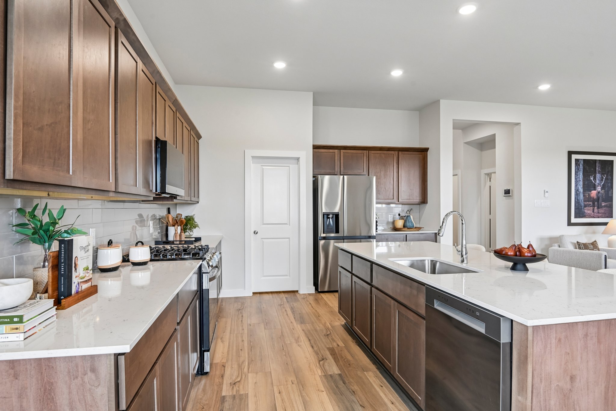 A kitchen with wooden cabinets.