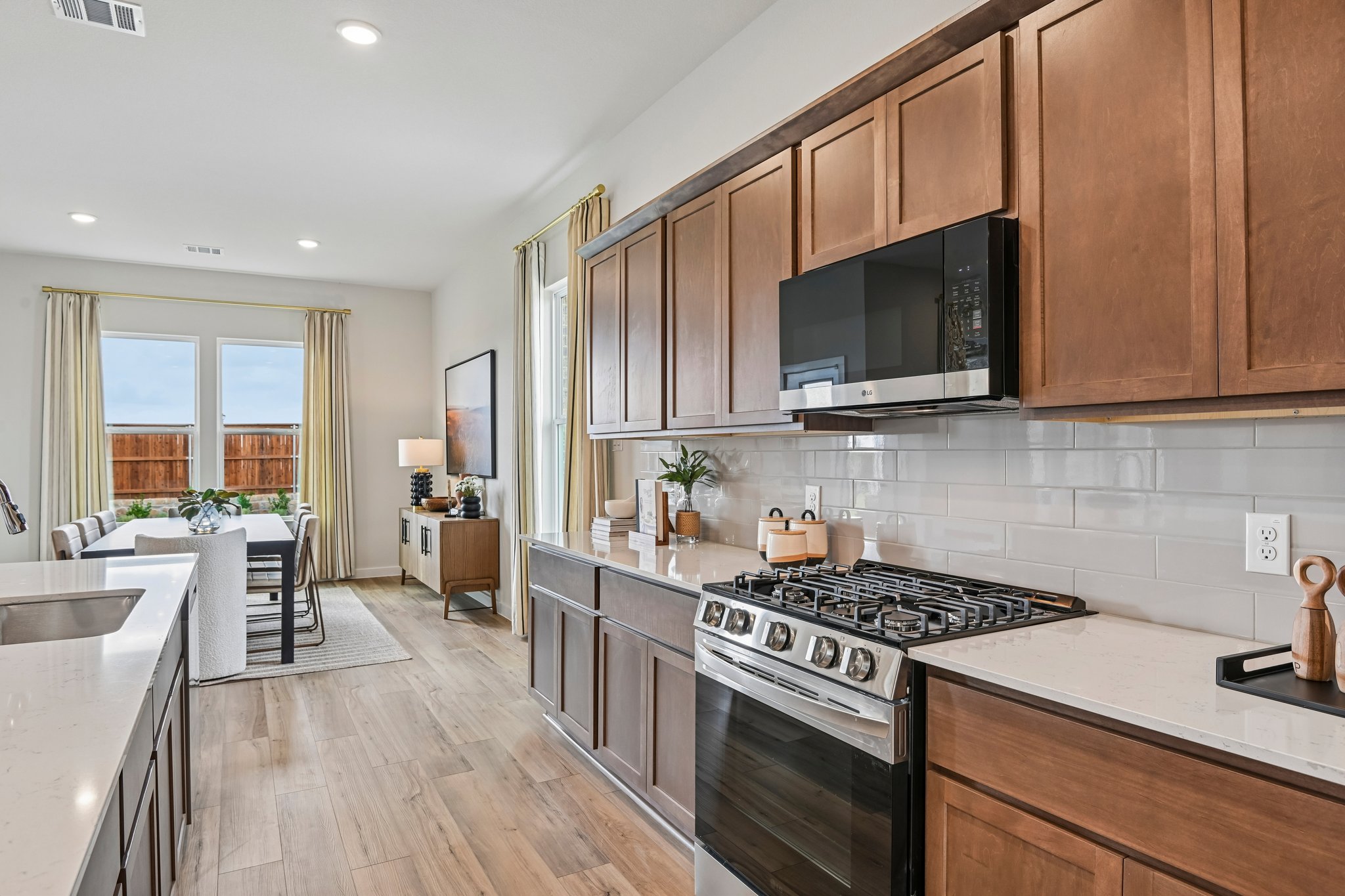 A kitchen with wooden cabinets.