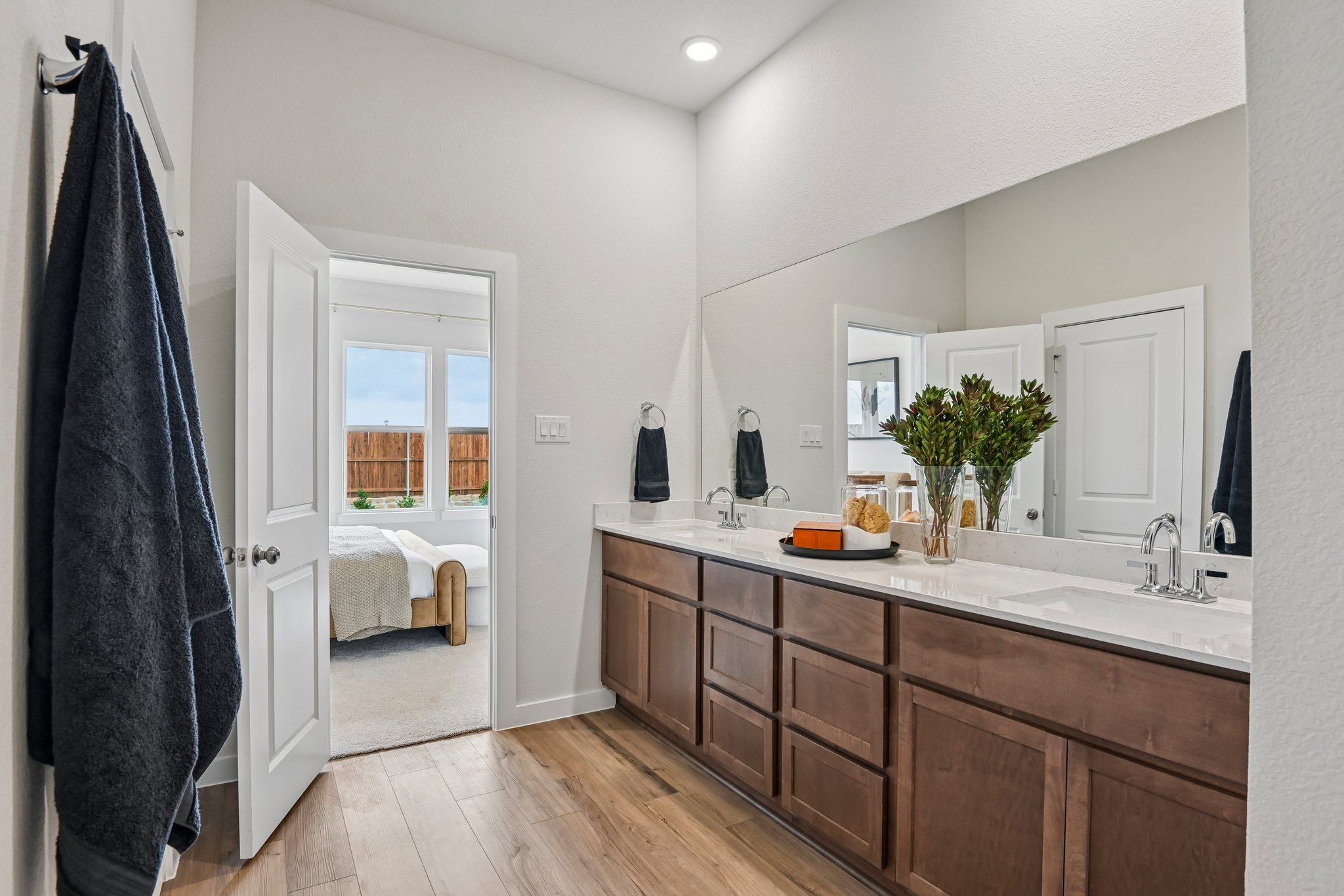 A bathroom with a large mirror.