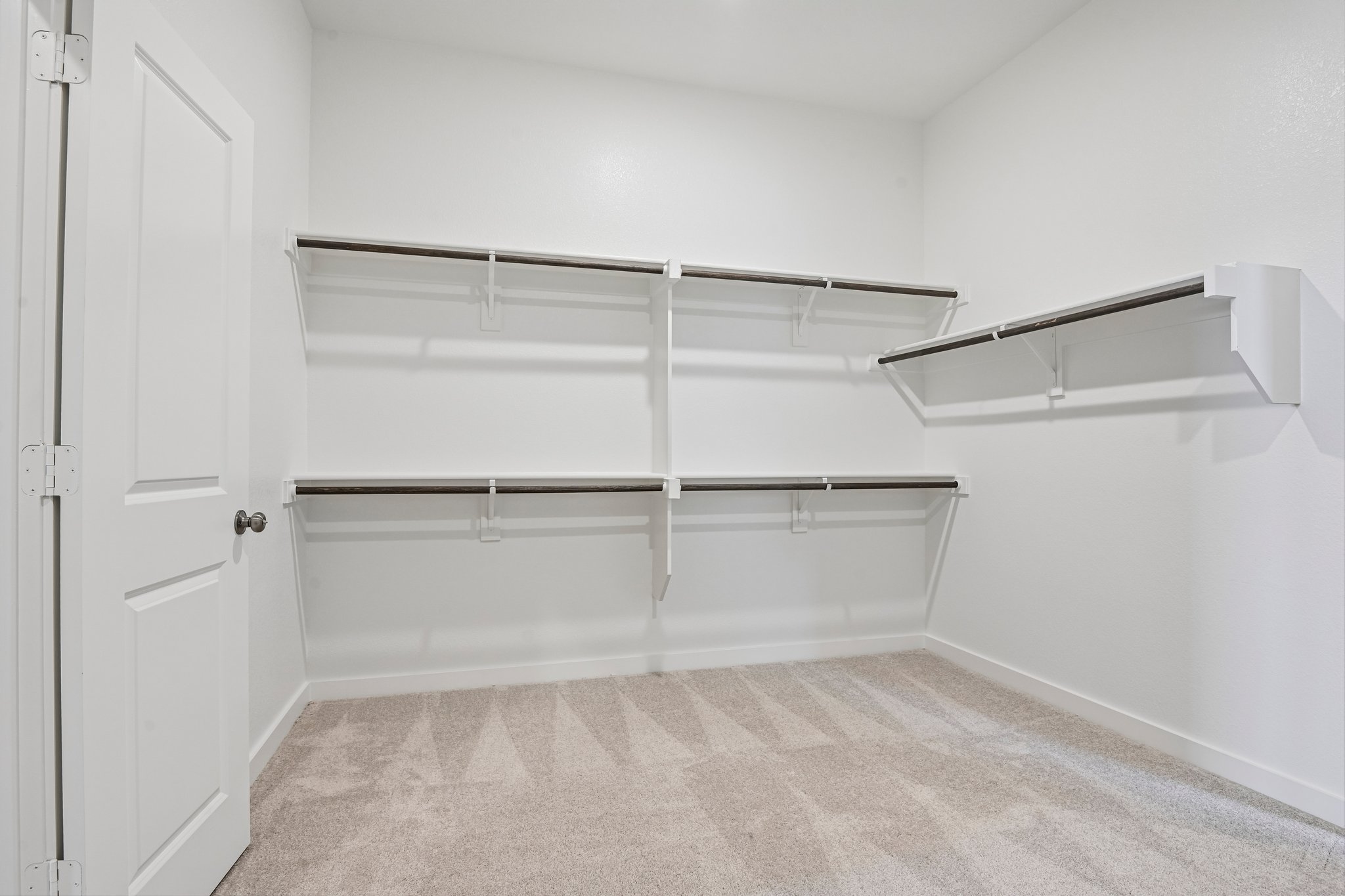 A white shelving unit in a room.