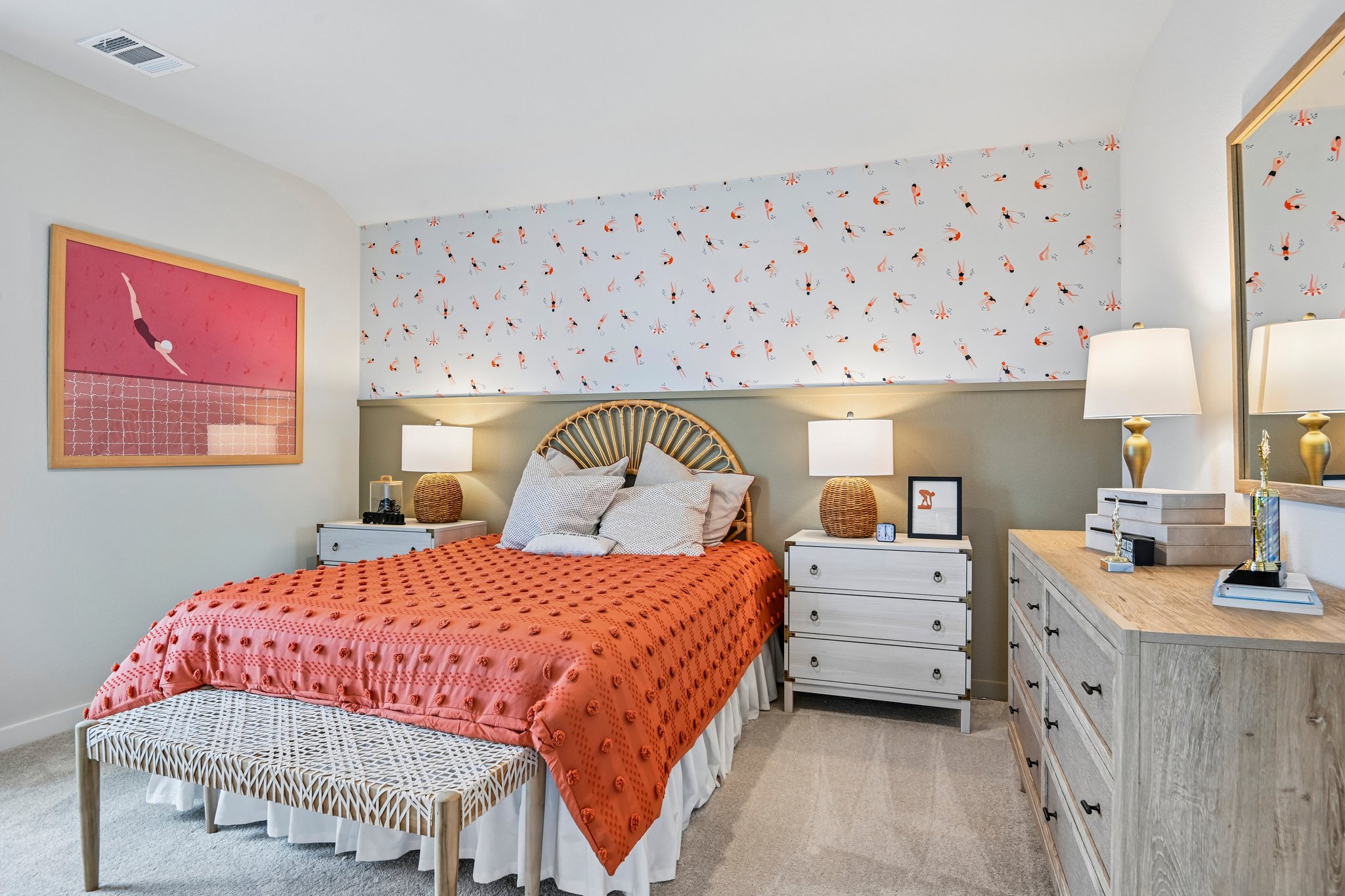 A bedroom with a bed and lamps.