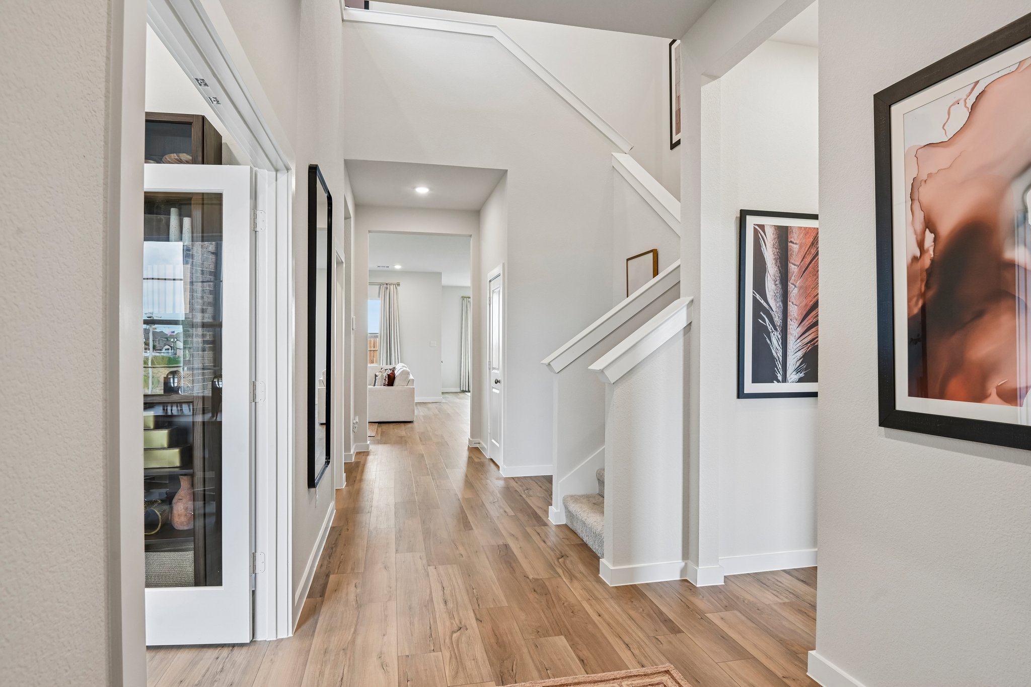 A hallway with white walls.