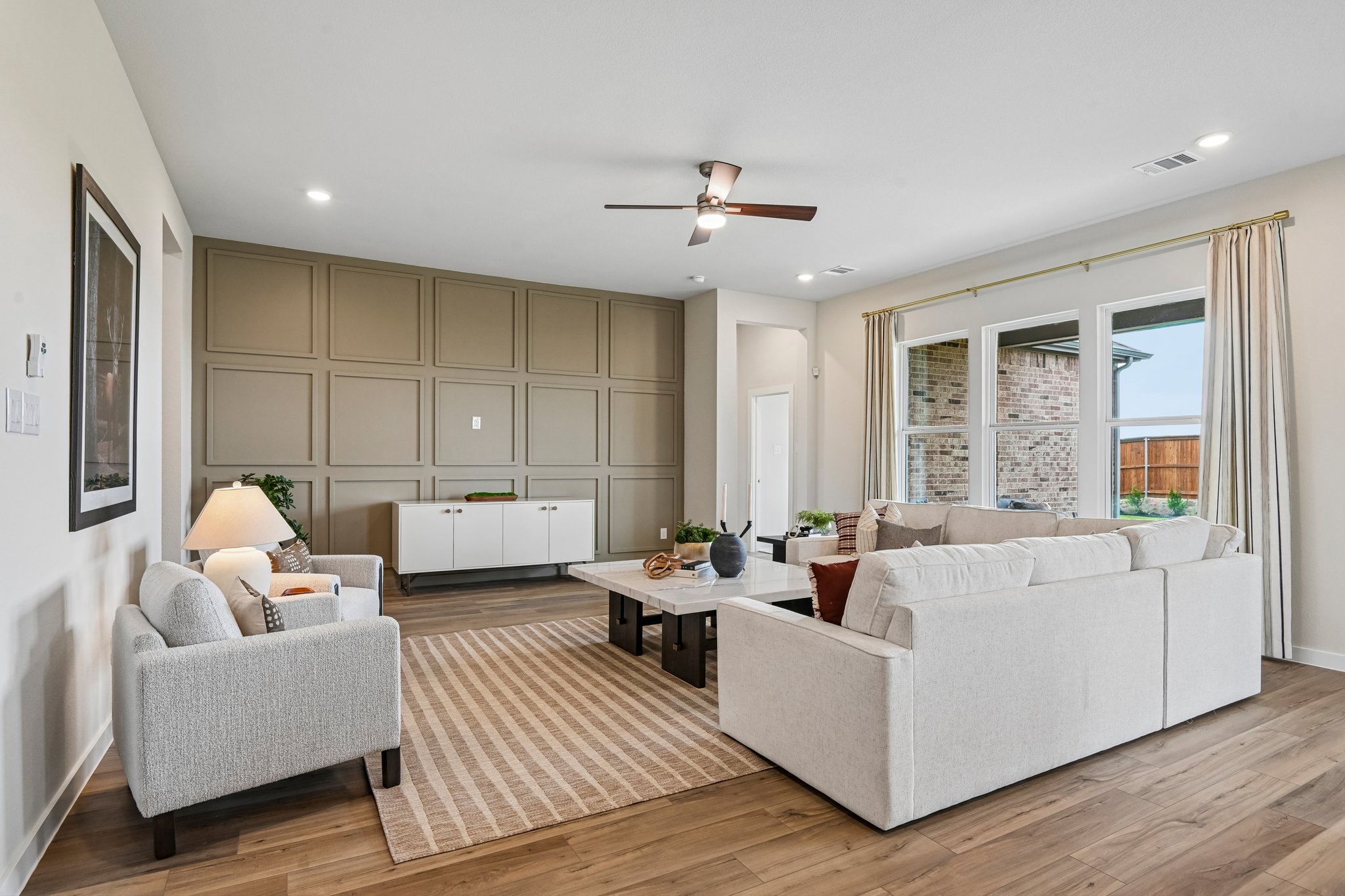 A living room with a large window.