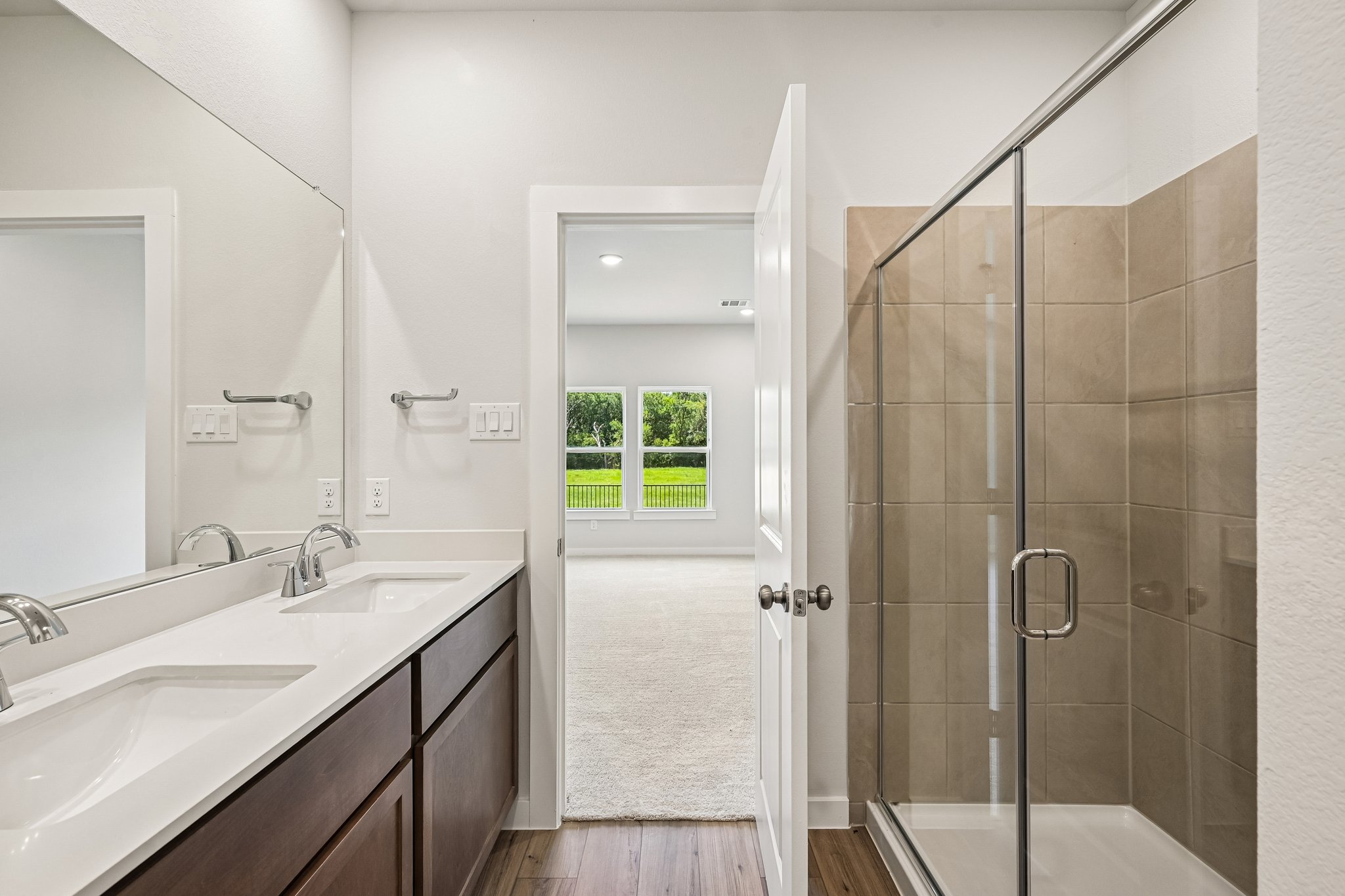 A bathroom with a glass shower.