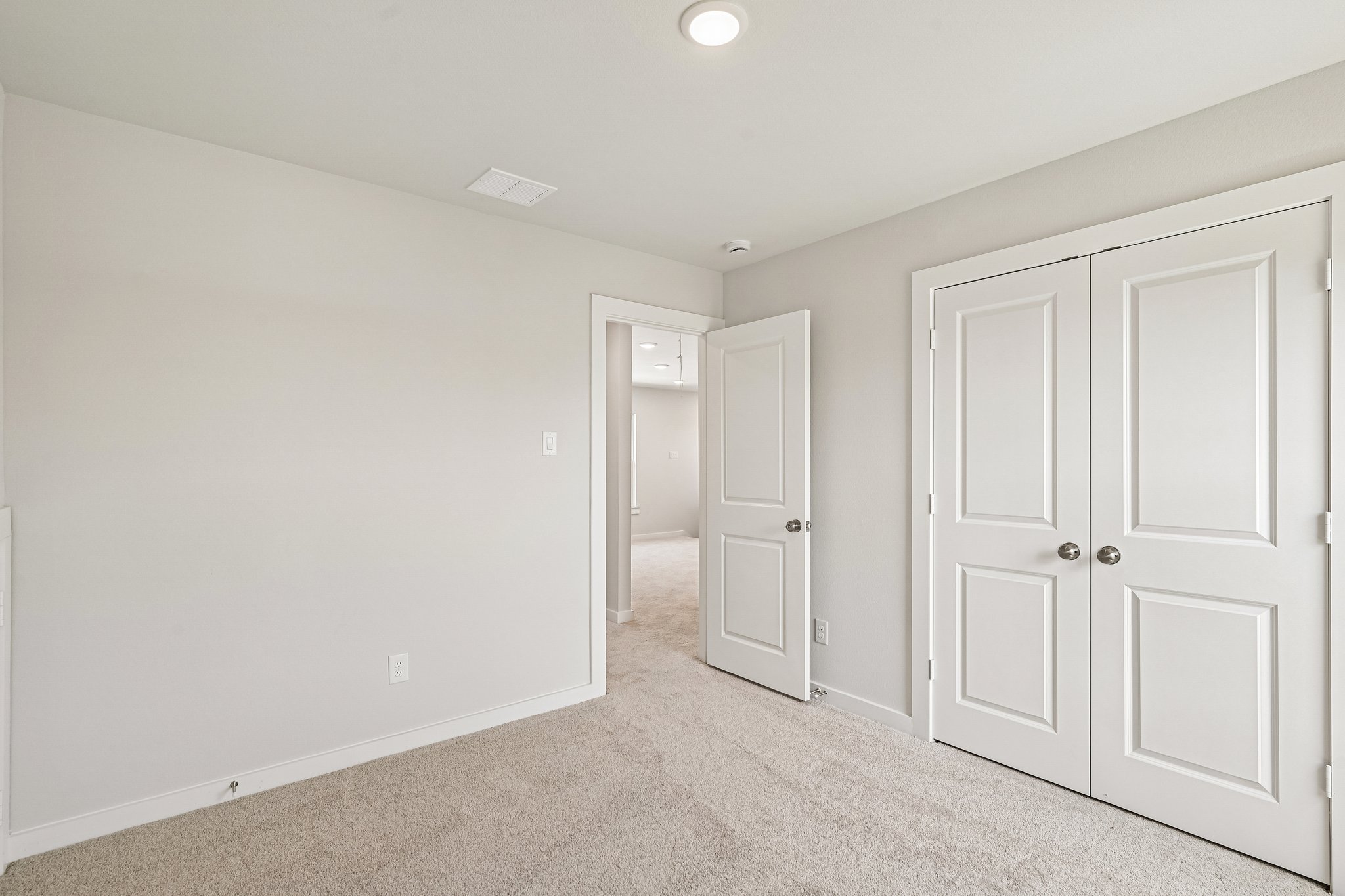 A room with white doors.