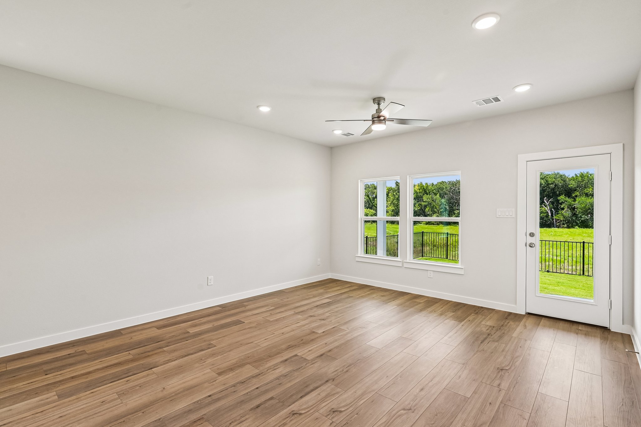 A room with a wood floor and a wood floor with a wood floor.