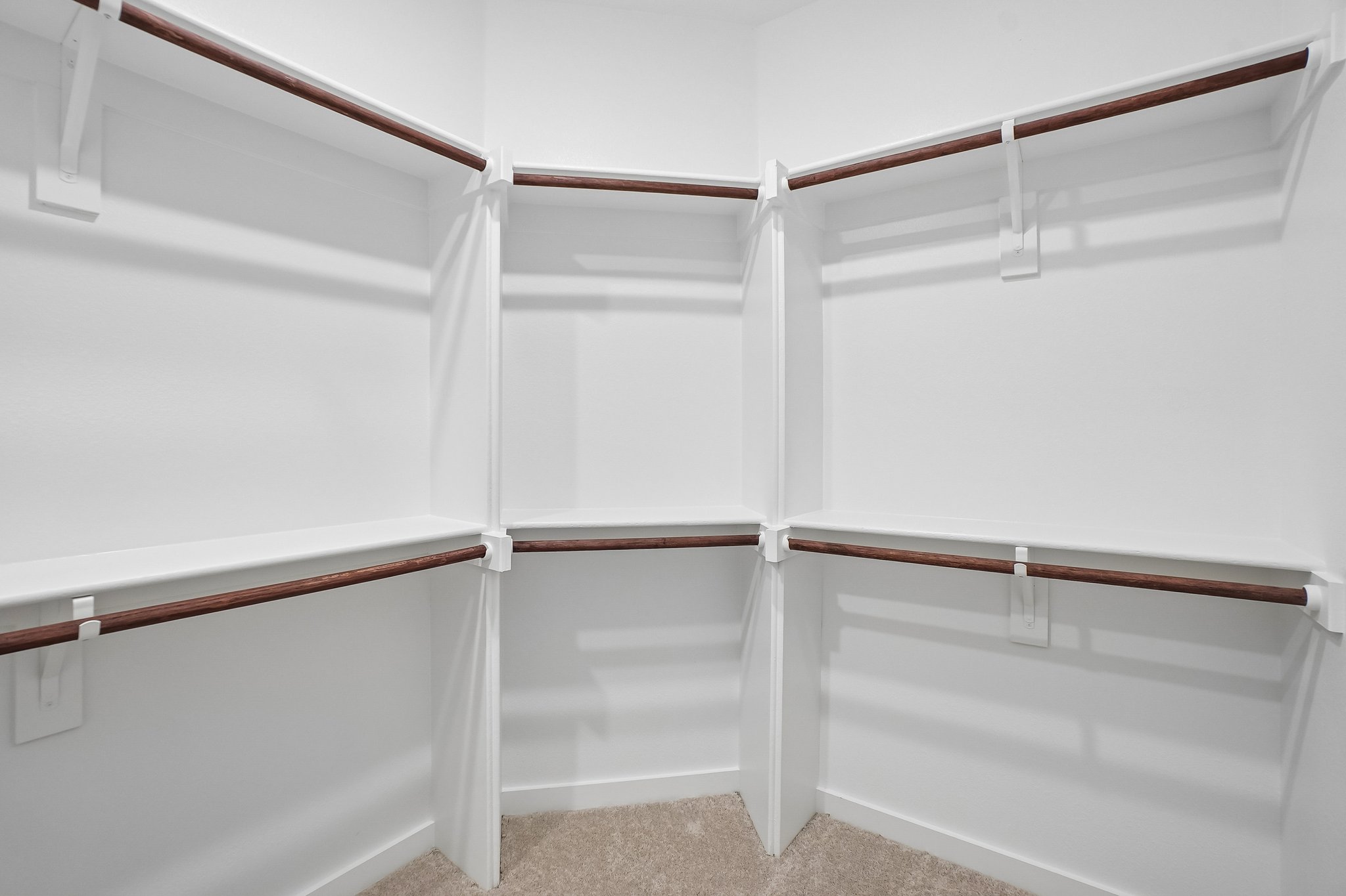 A white staircase with white walls.