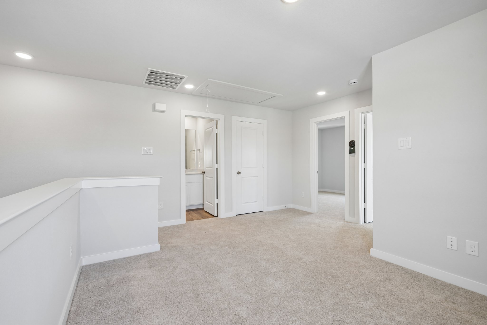 A room with white cabinets.