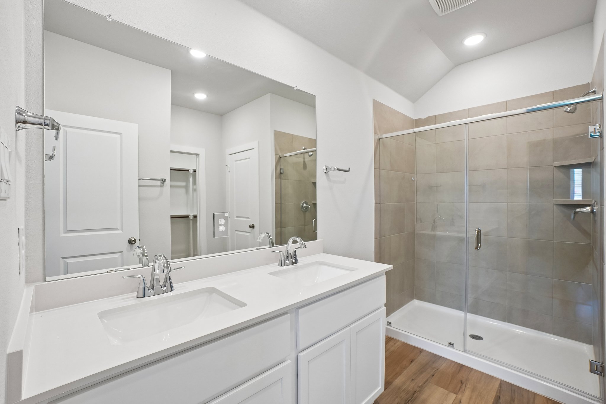 A bathroom with a glass shower.