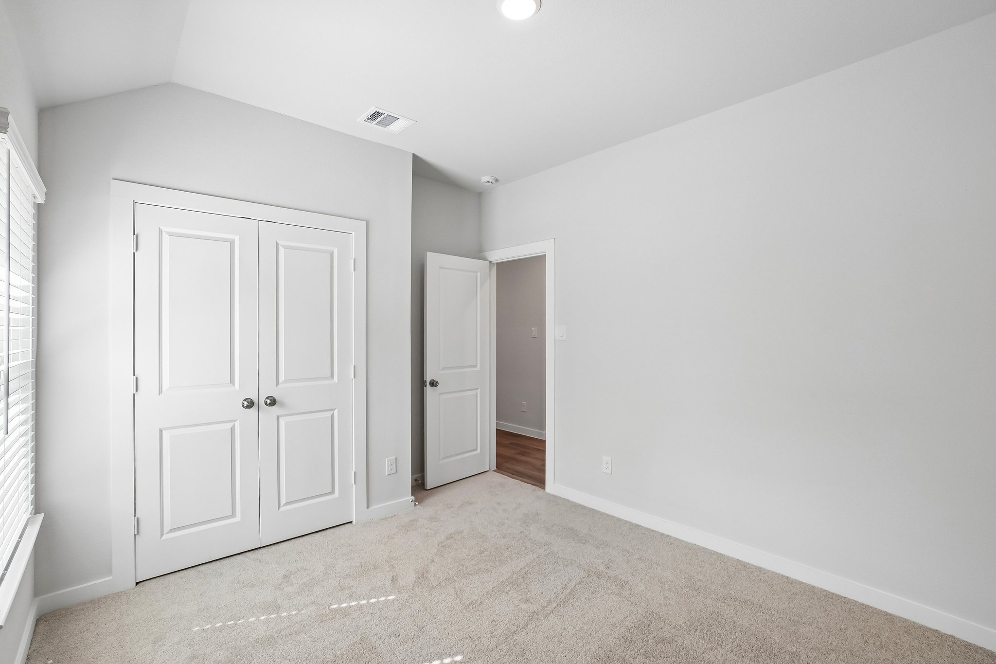 A room with white doors.