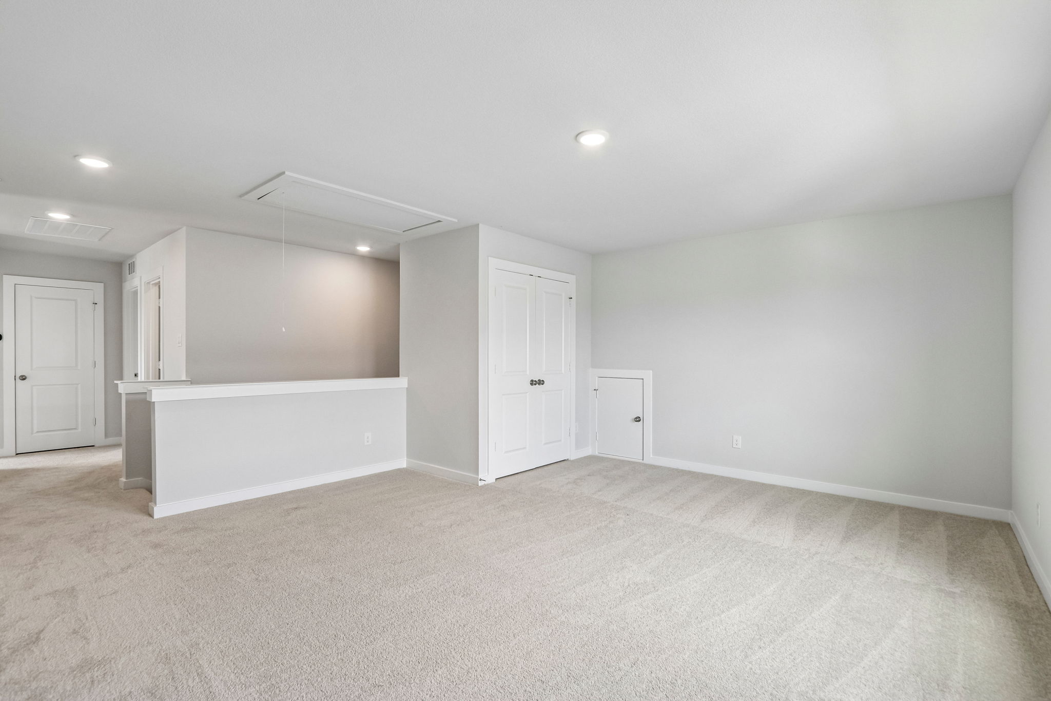 A room with white walls and a white counter.
