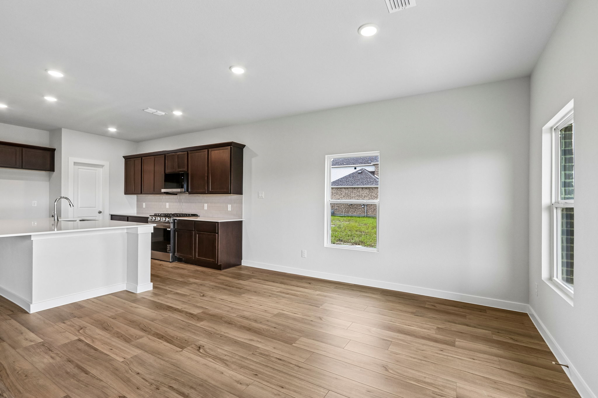 A kitchen with wooden floors.