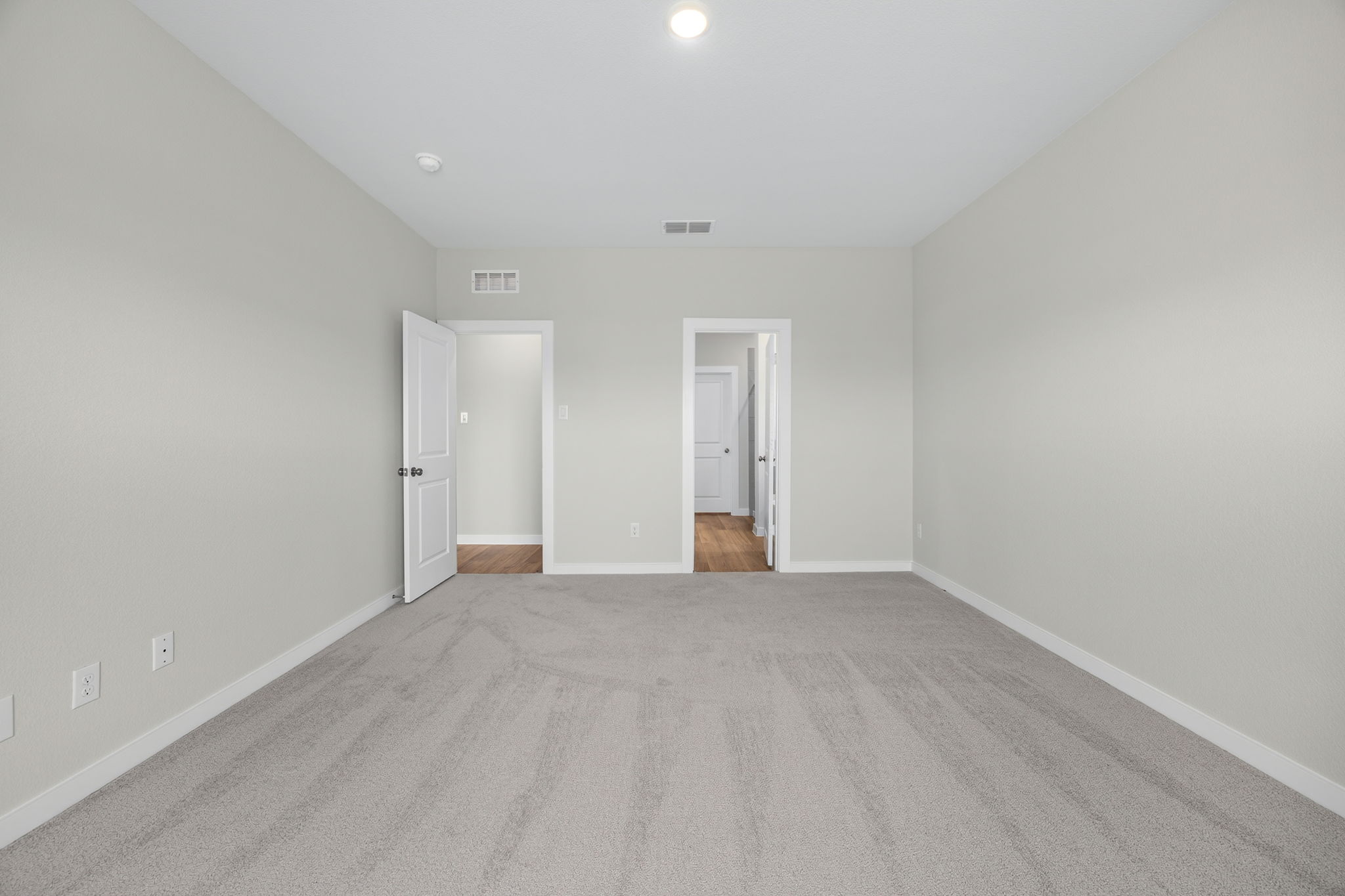 A hallway with white walls.
