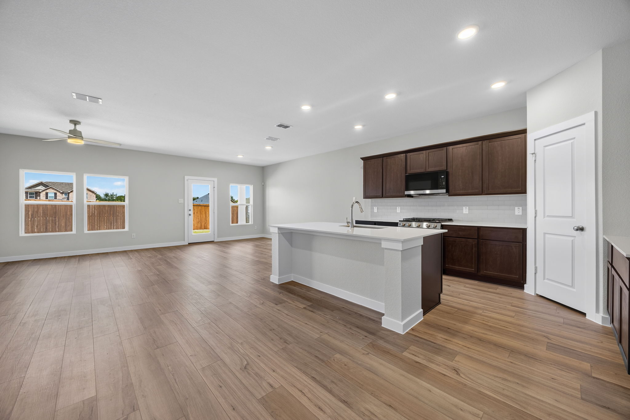 A kitchen with wooden floors.