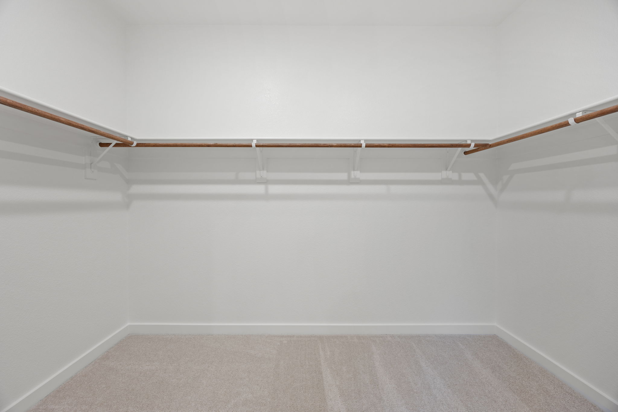A white wall with a wooden frame.