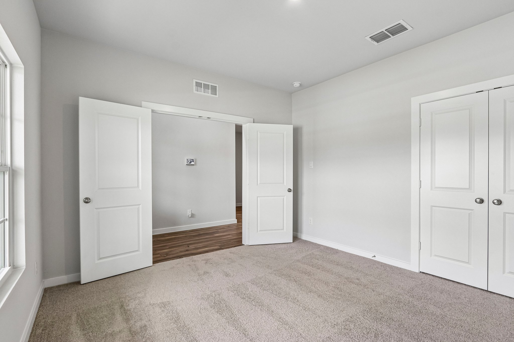 A room with white doors.