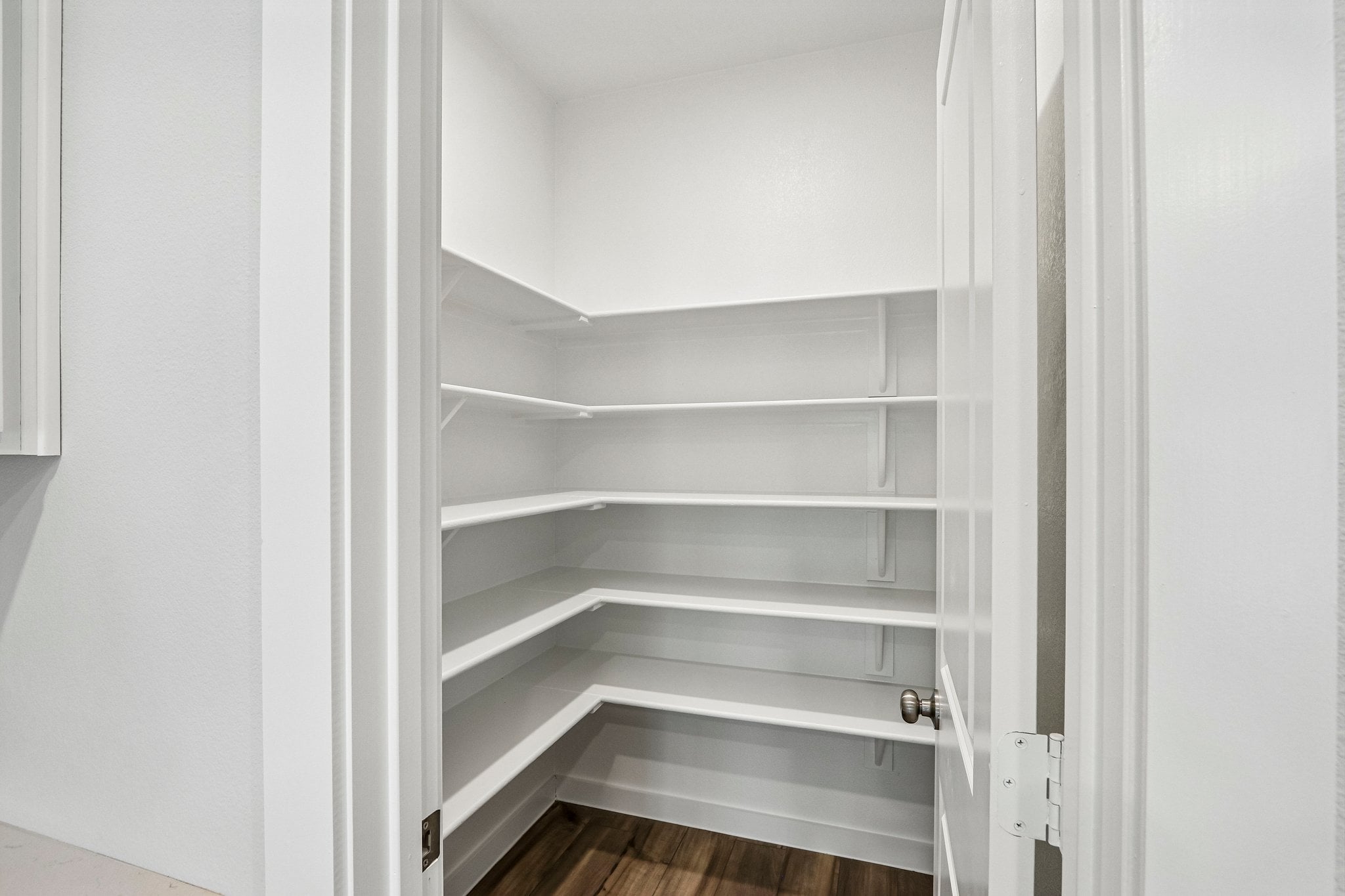 A white staircase in a room.