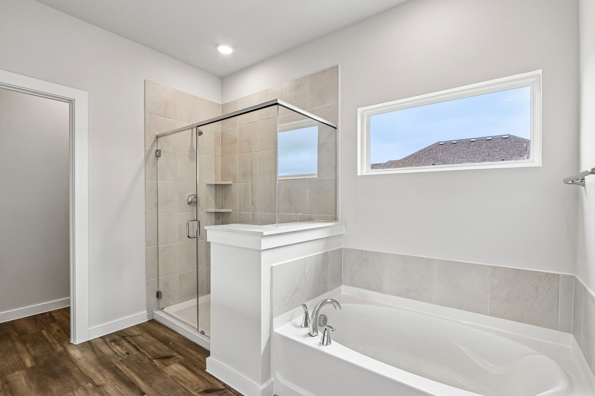 A bathroom with a glass shower.