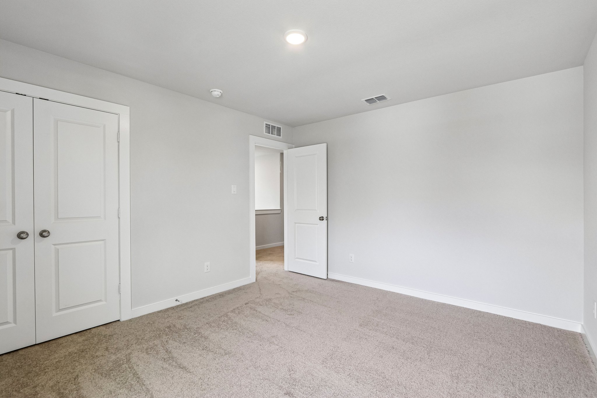 A room with white doors.