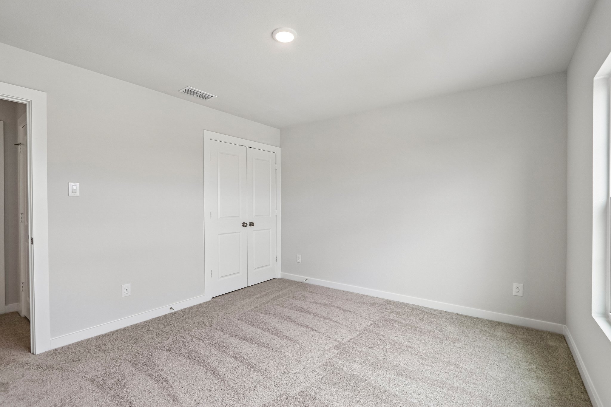 A room with white doors.