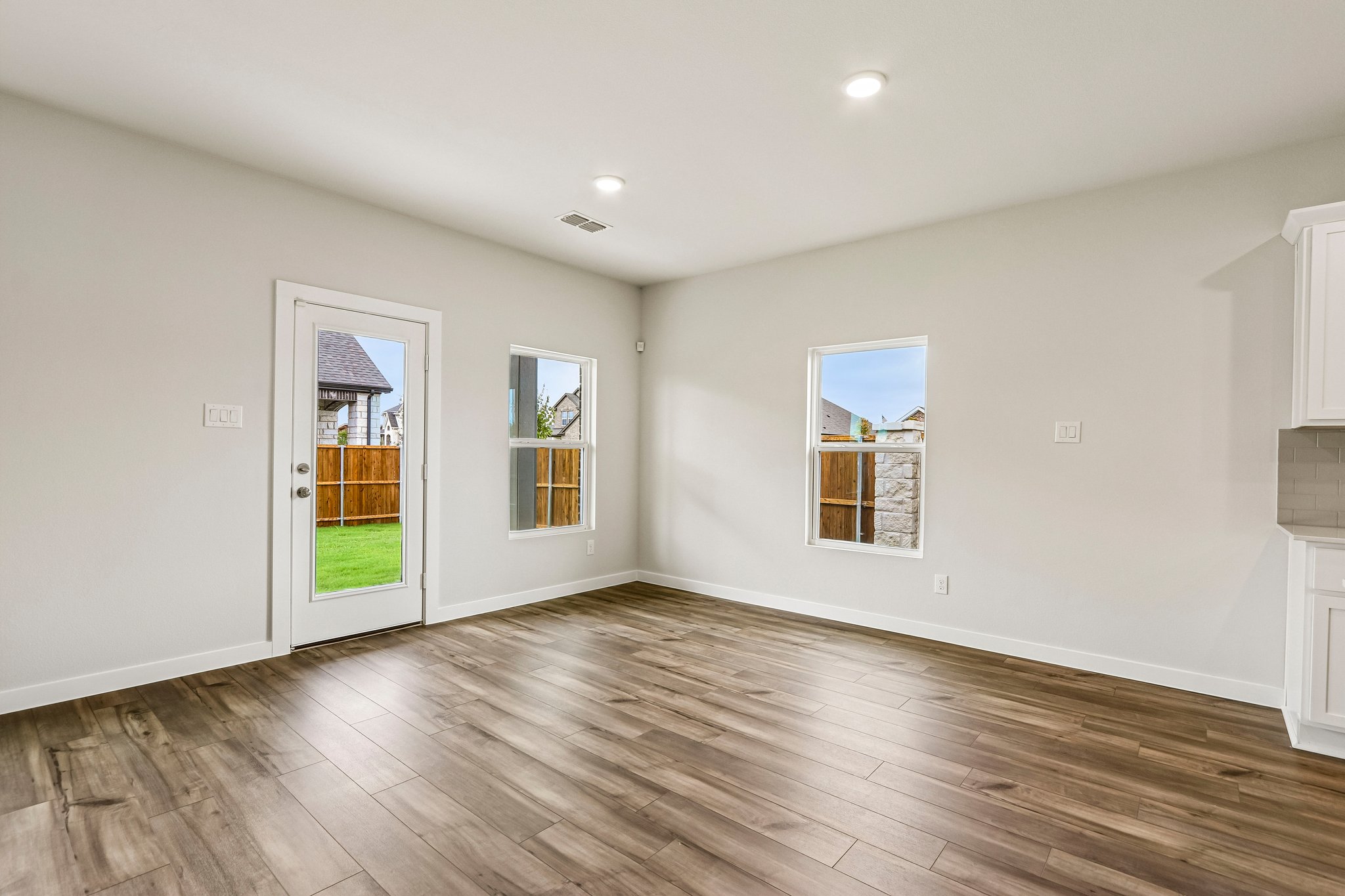 A room with a wood floor and a wood floor.