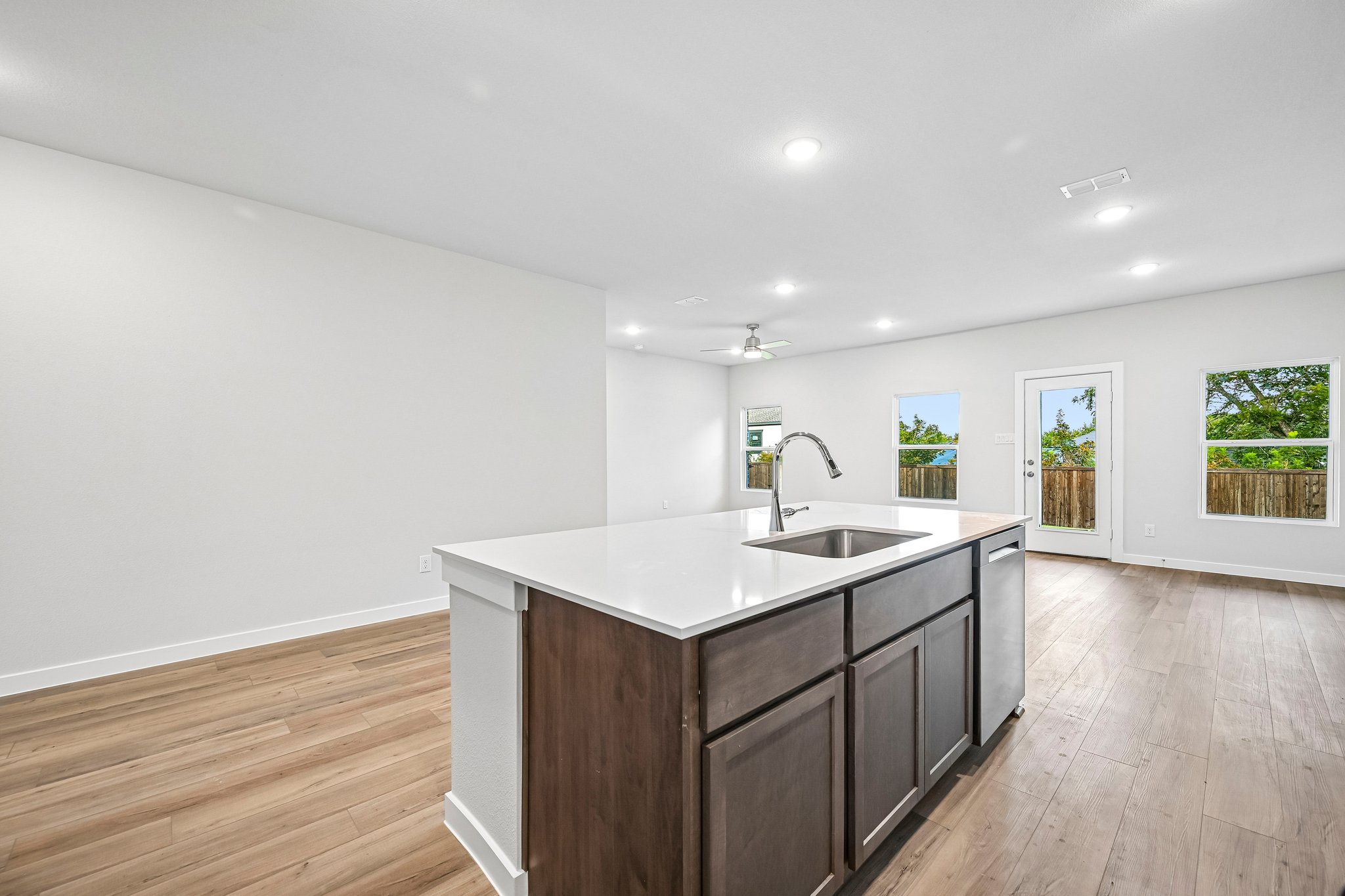 A kitchen with a sink and cabinets.