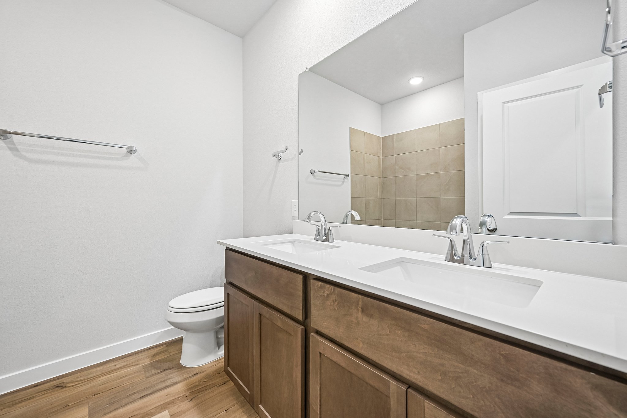 A bathroom with a tub sink and toilet.