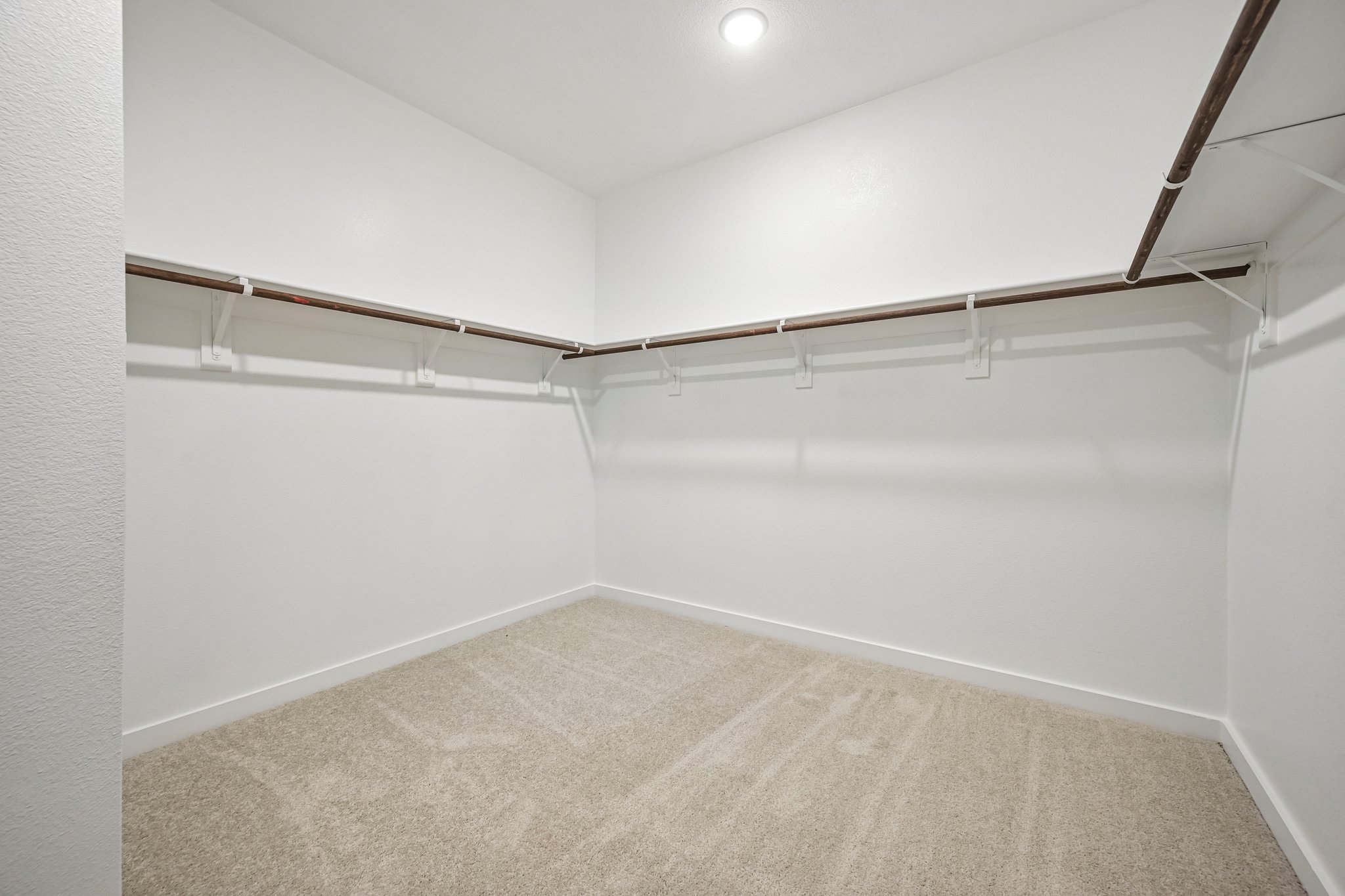 A hallway with white walls.