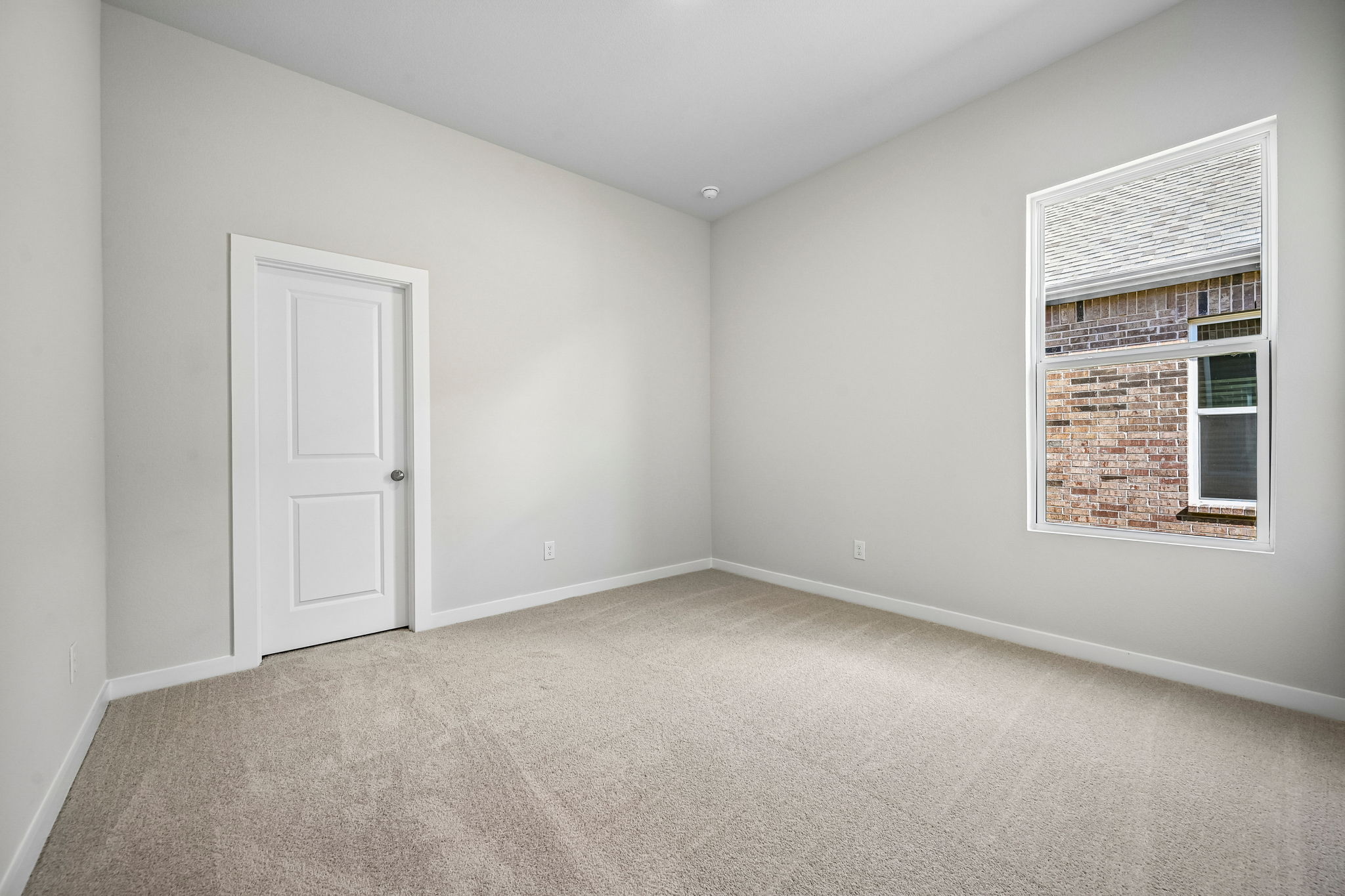 A room with a door and a window.