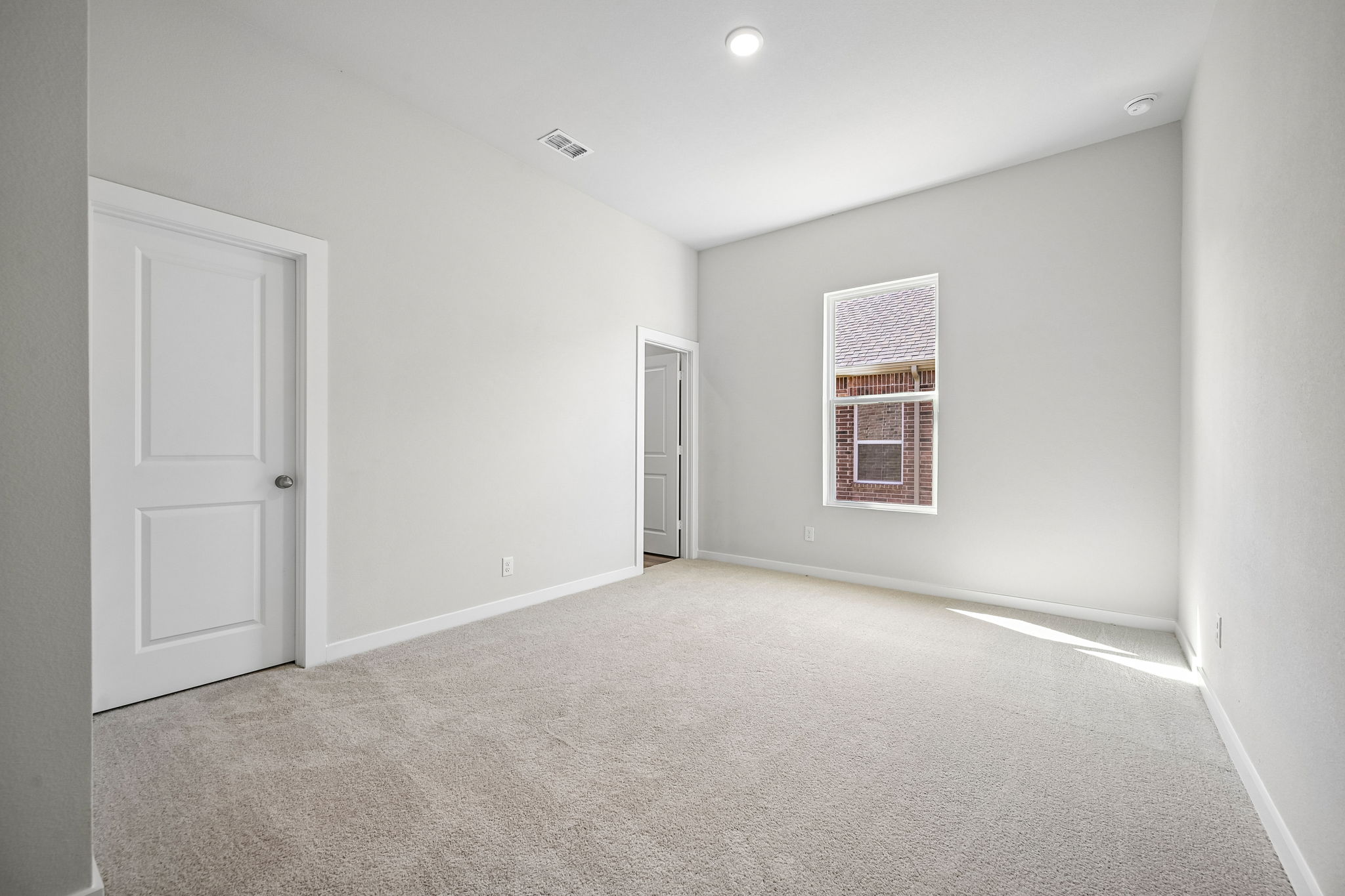 A room with a door and a window.