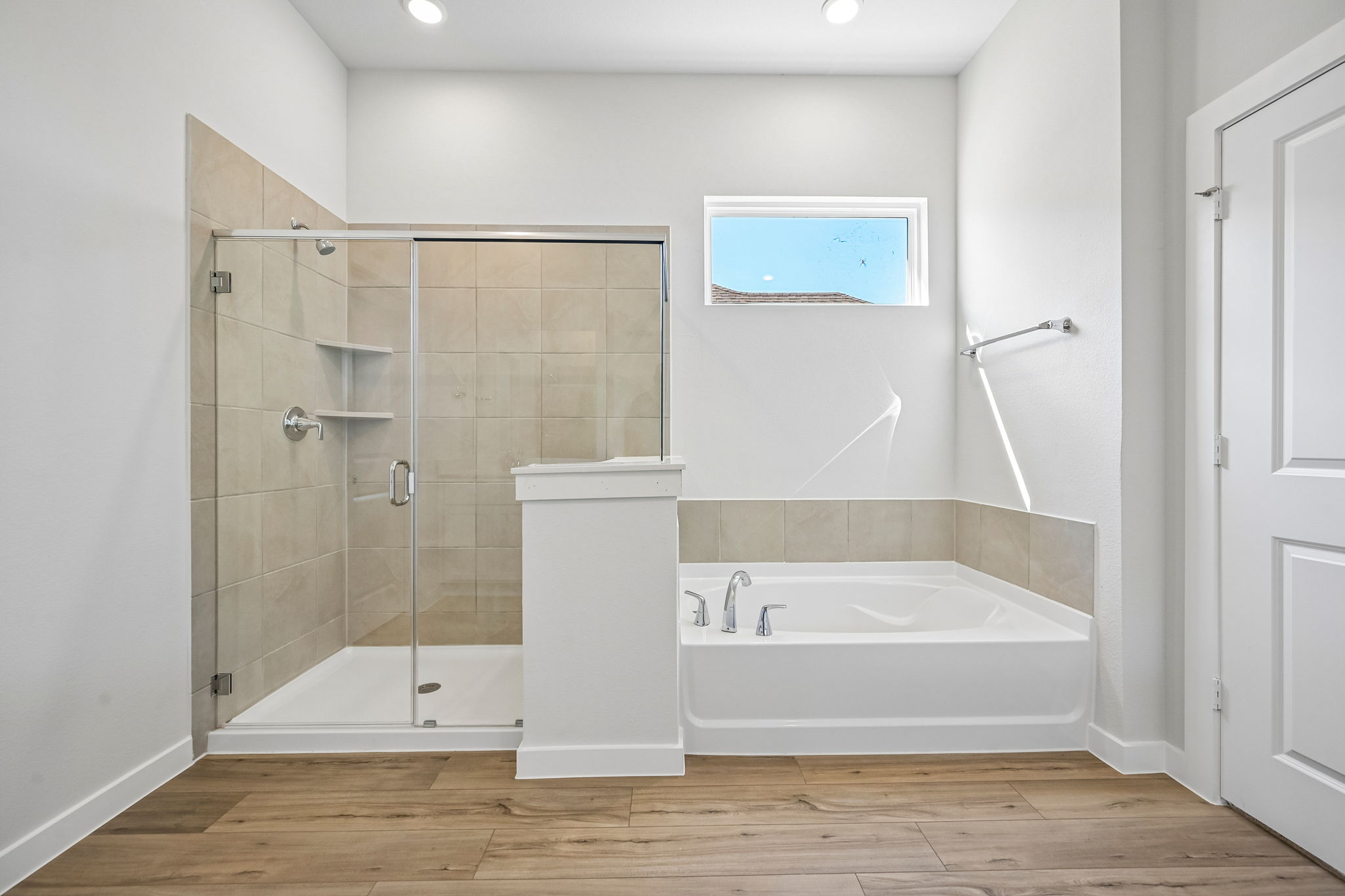 A bathroom with a glass shower.