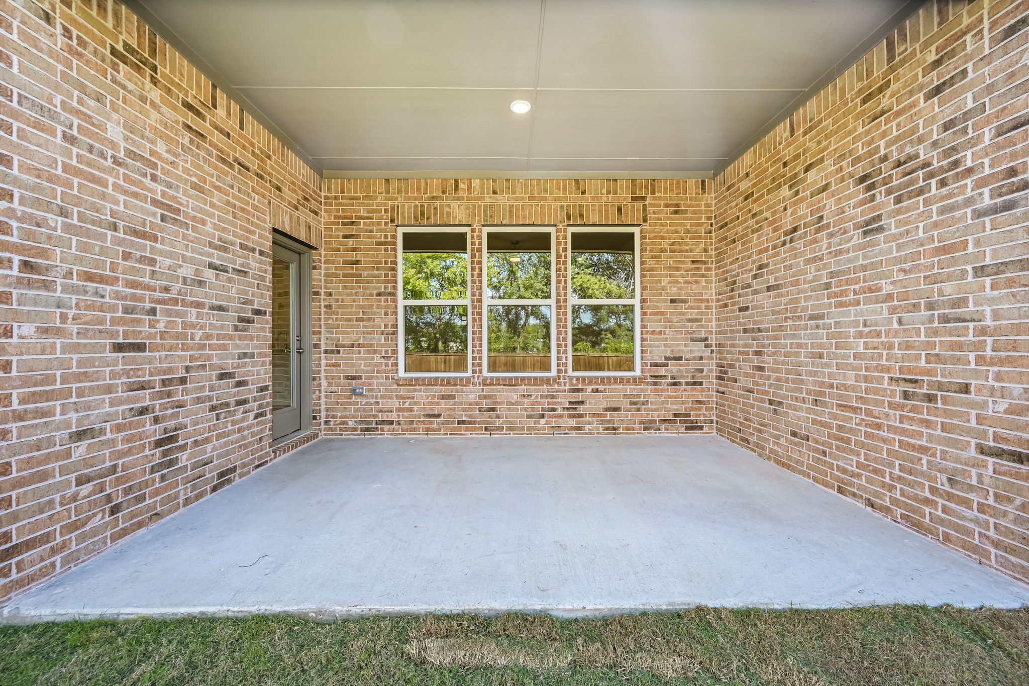 A brick building with a white carpet.