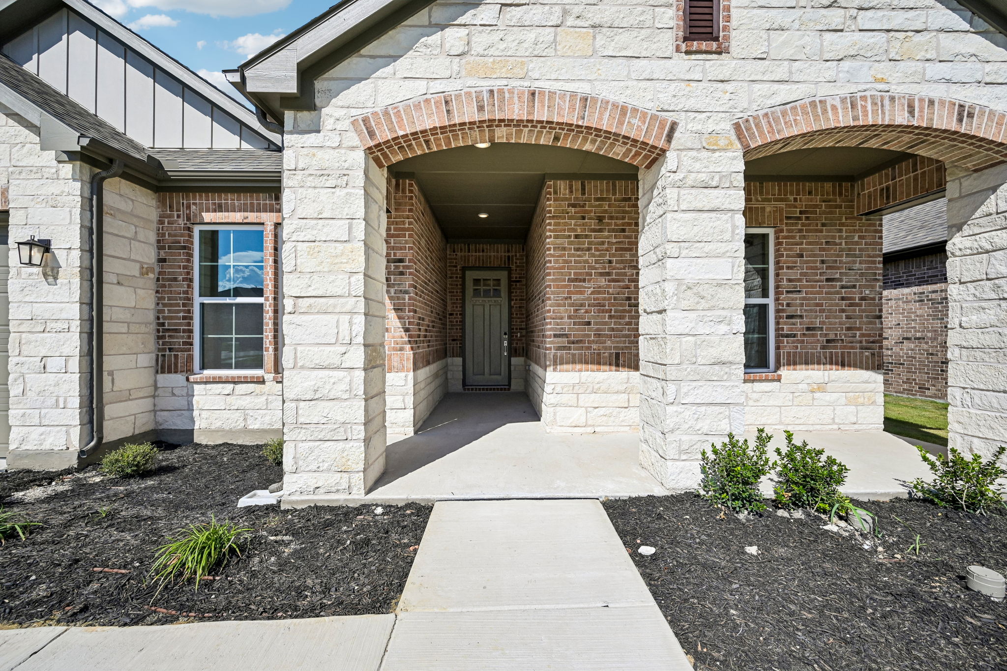 A brick building with a door.