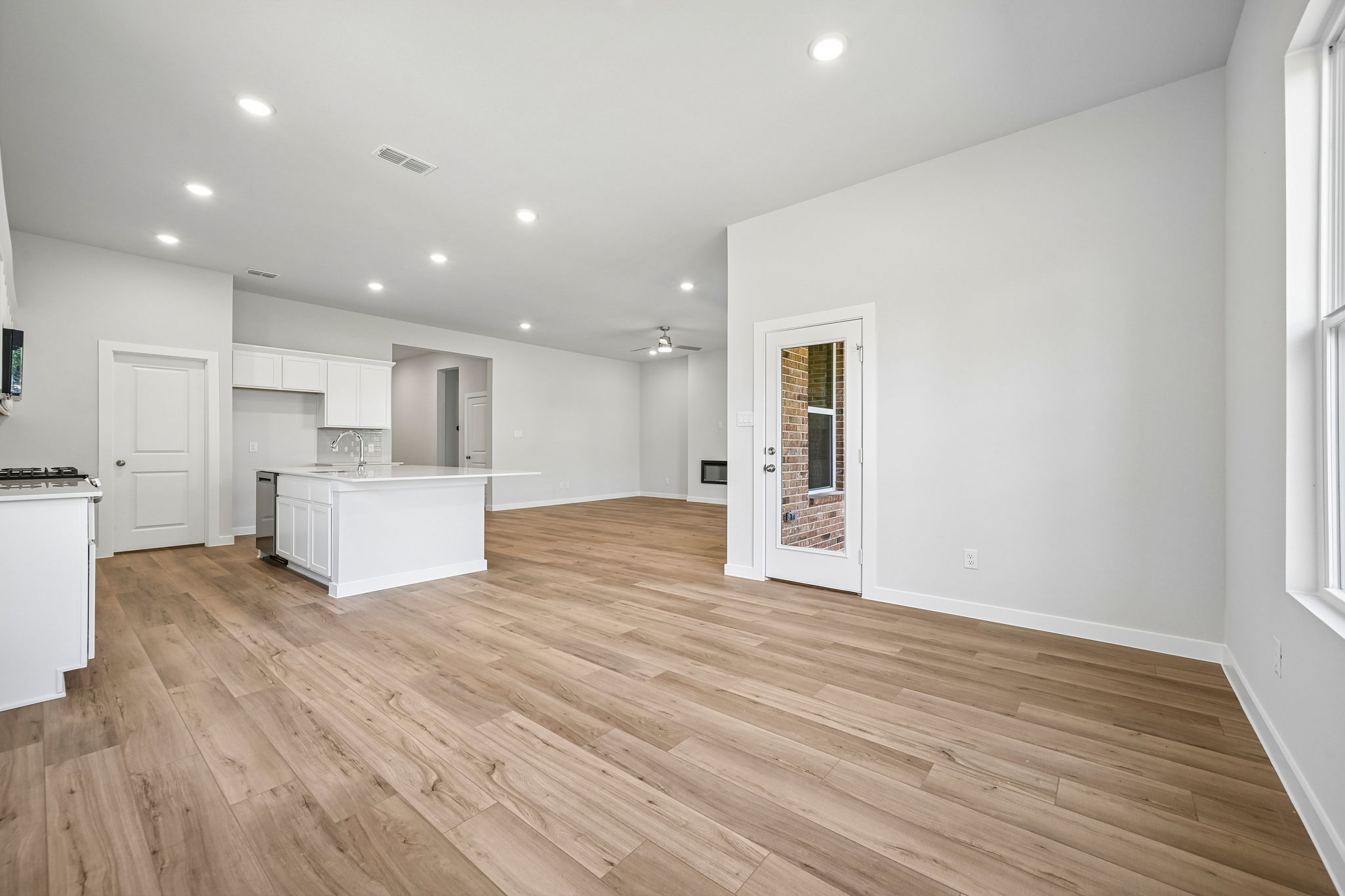 A large kitchen with white cabinets.
