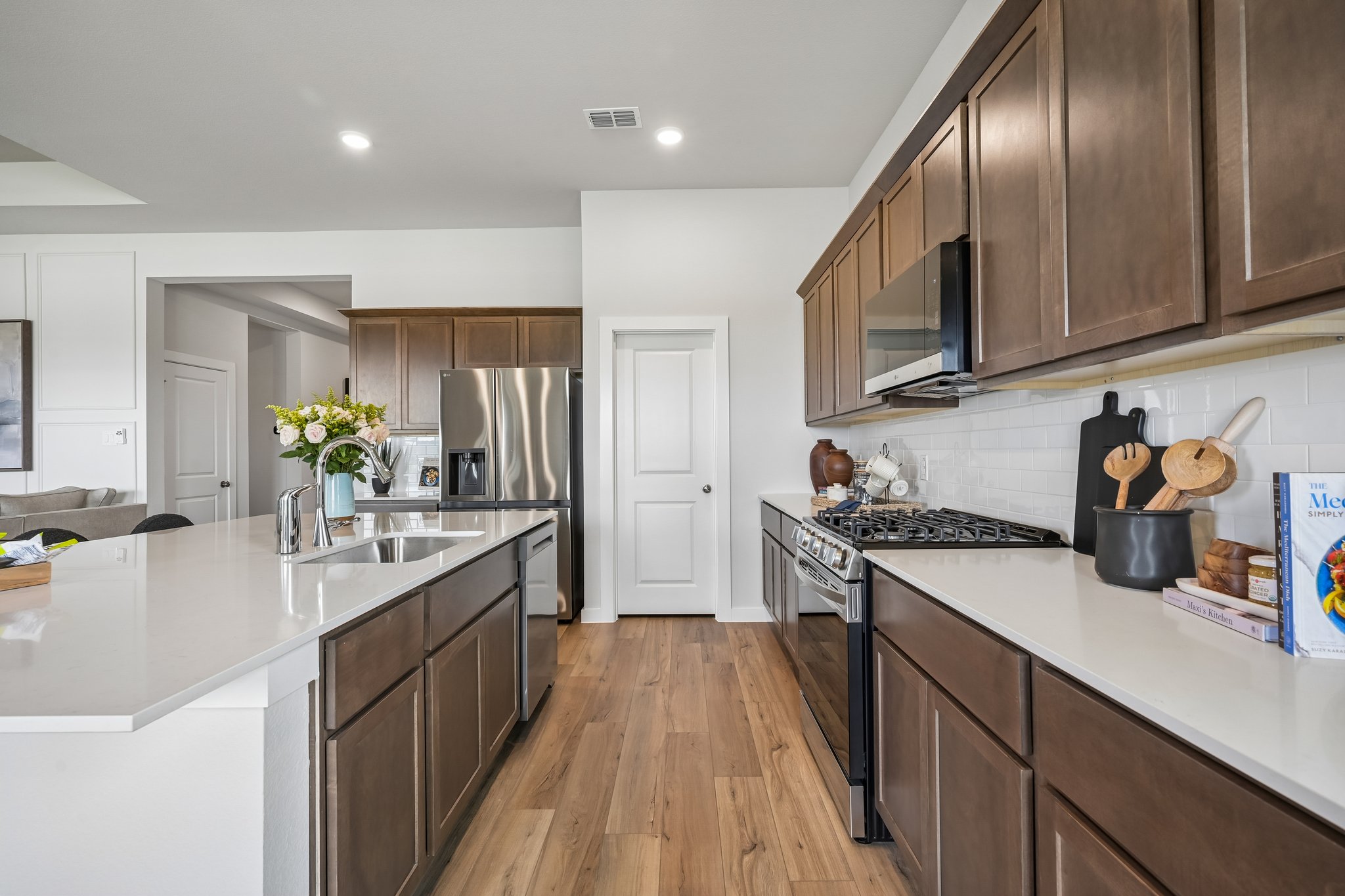 A kitchen with wooden cabinets.