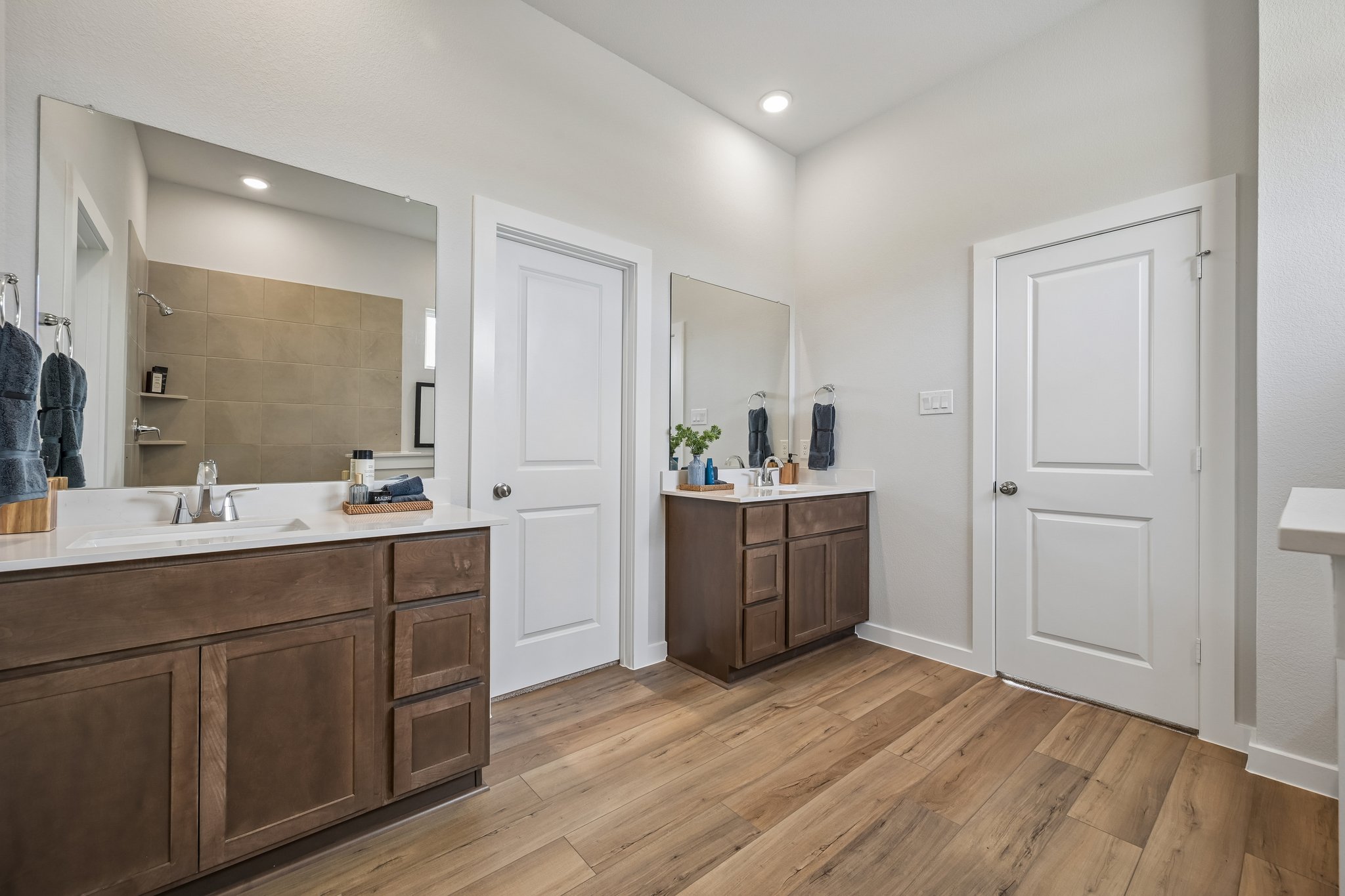 A bathroom with a large mirror.