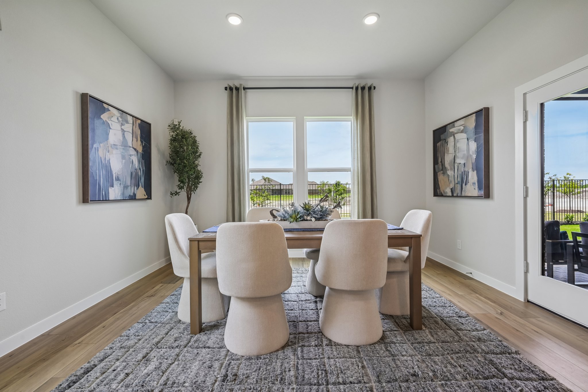 A room with a table and chairs.