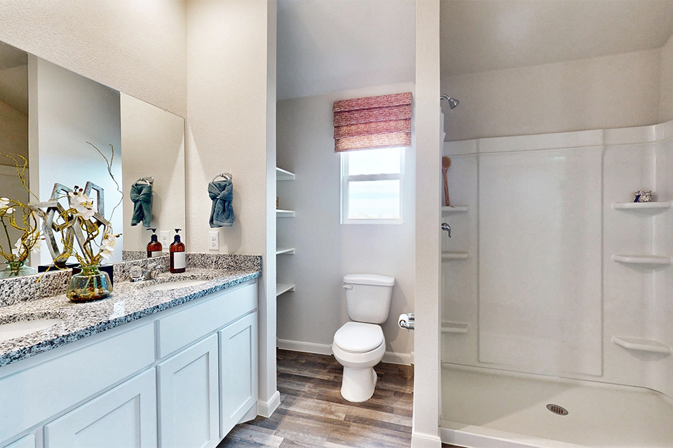 A bathroom with a tub toilet and sink.