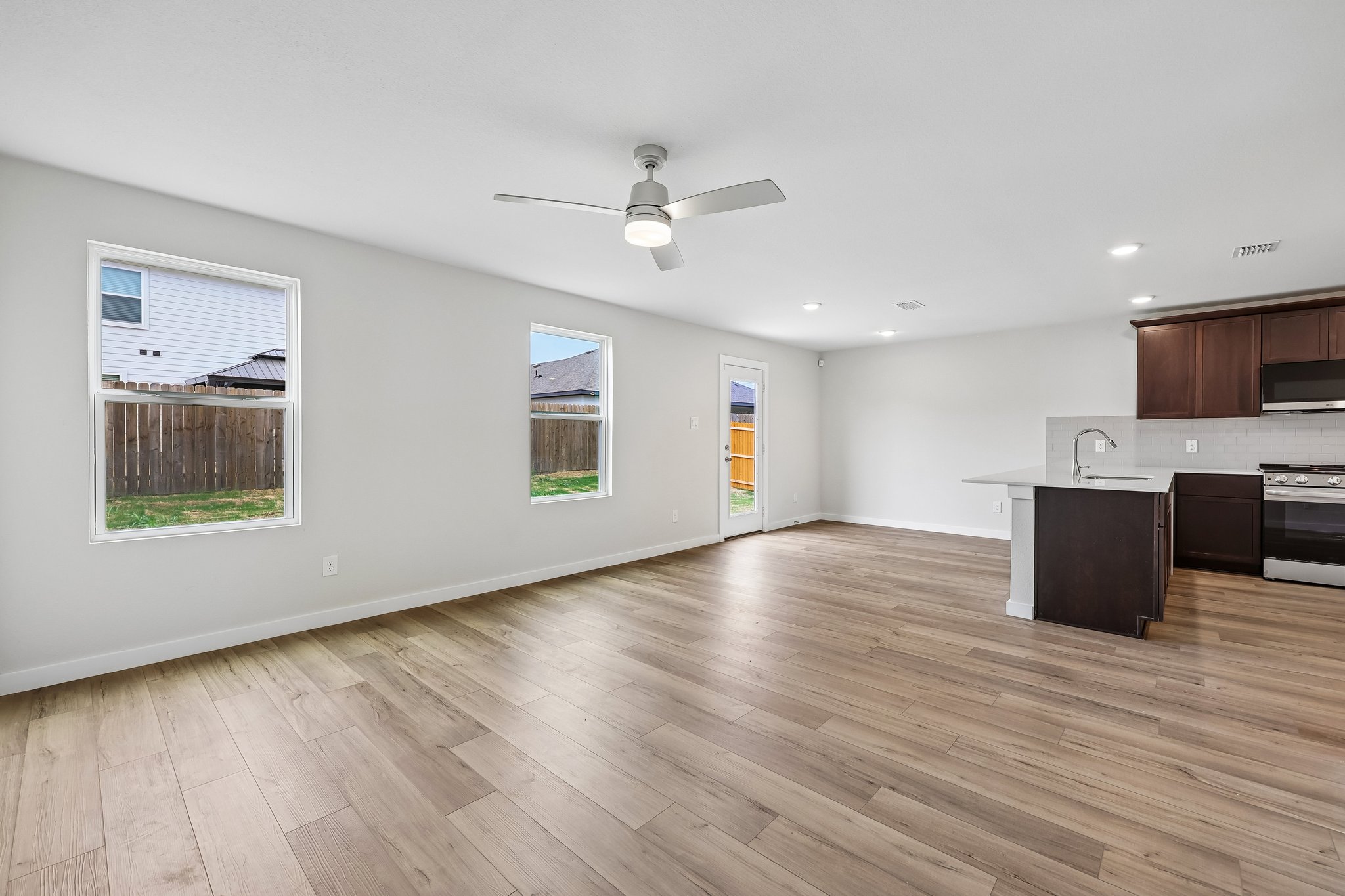 A kitchen with a wood floor.