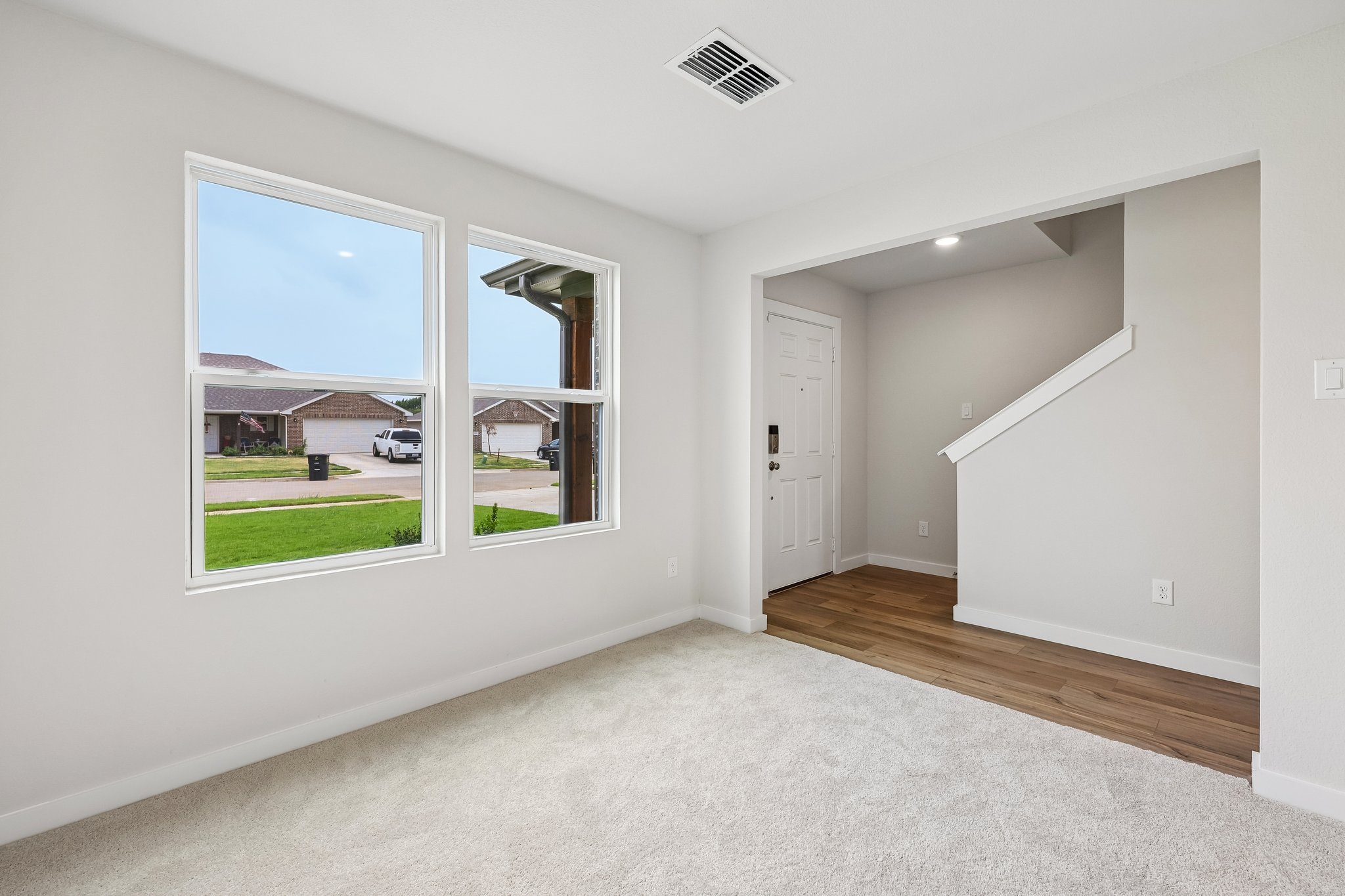 A room with a window and a door.