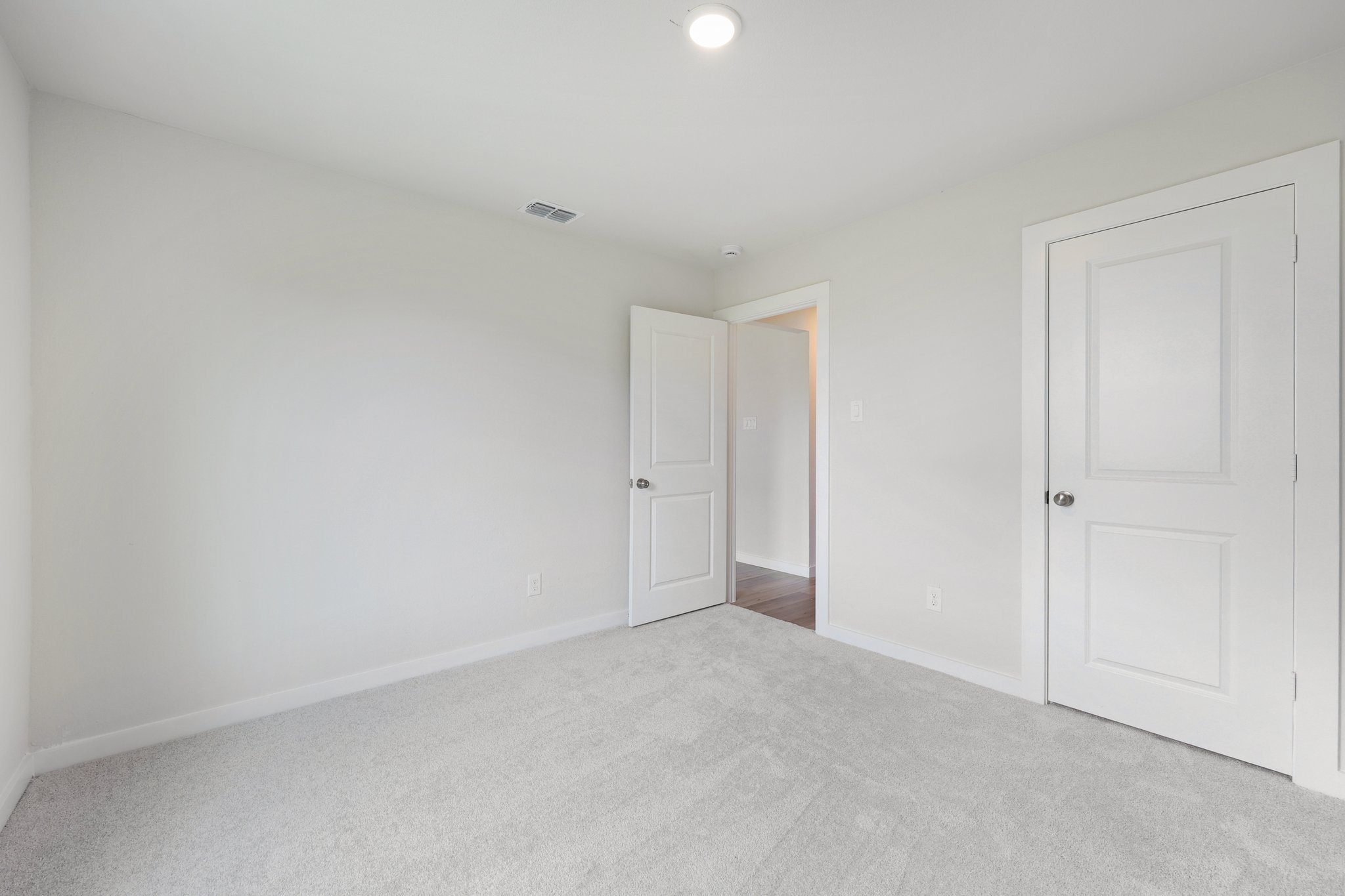 A room with white doors.
