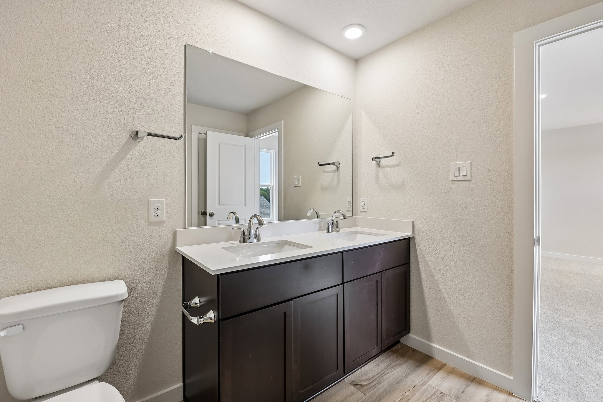 A bathroom with a sink and a toilet.