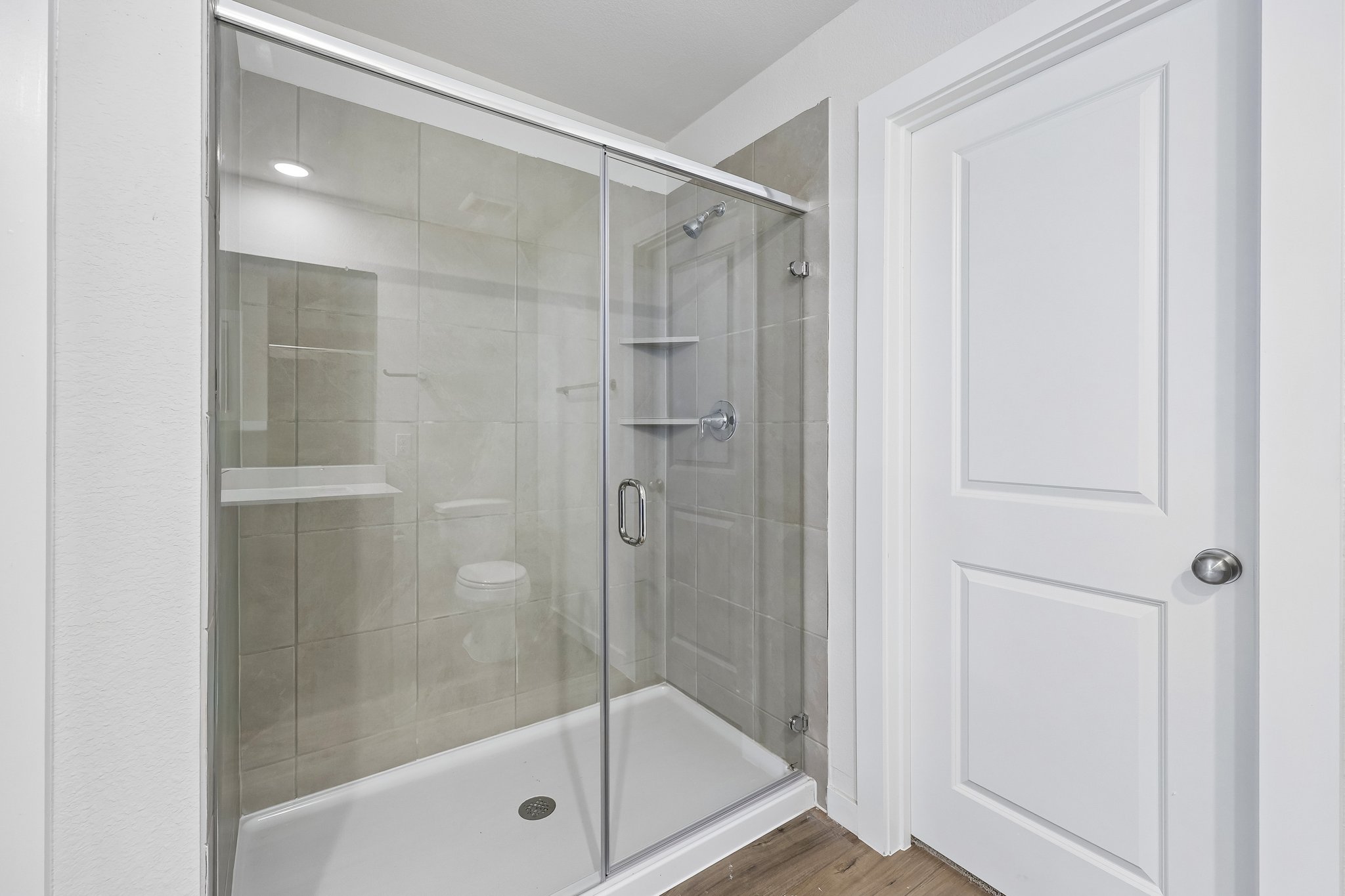 A bathroom with a glass shower.