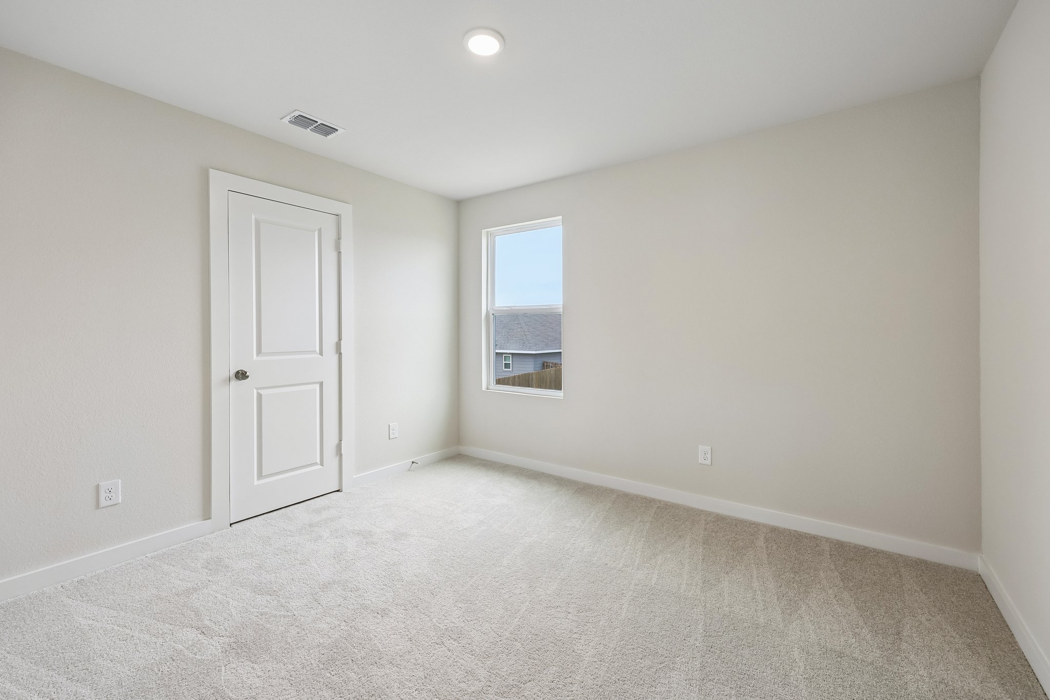 A room with a door and a window.