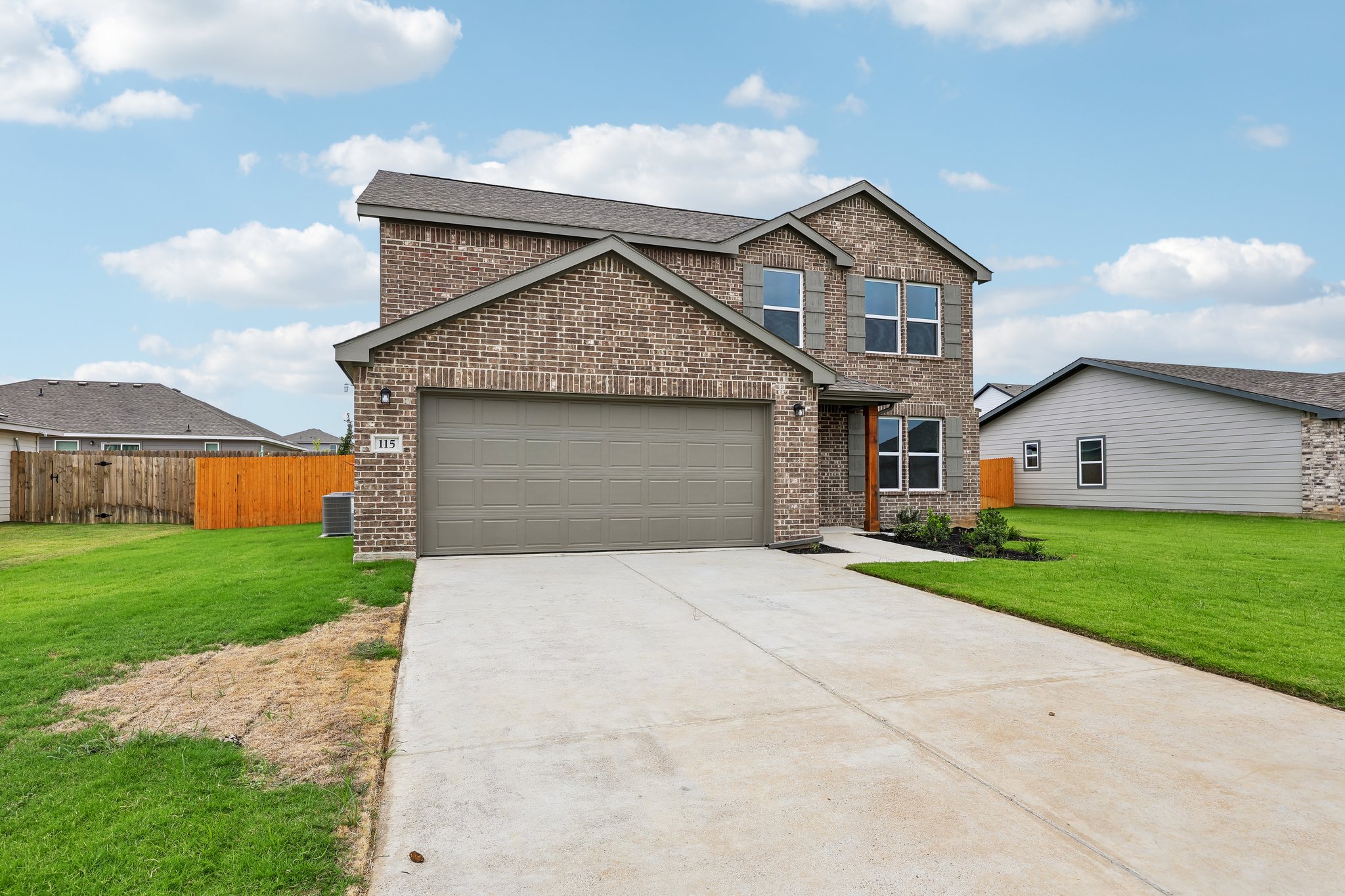 A driveway leading to a house.