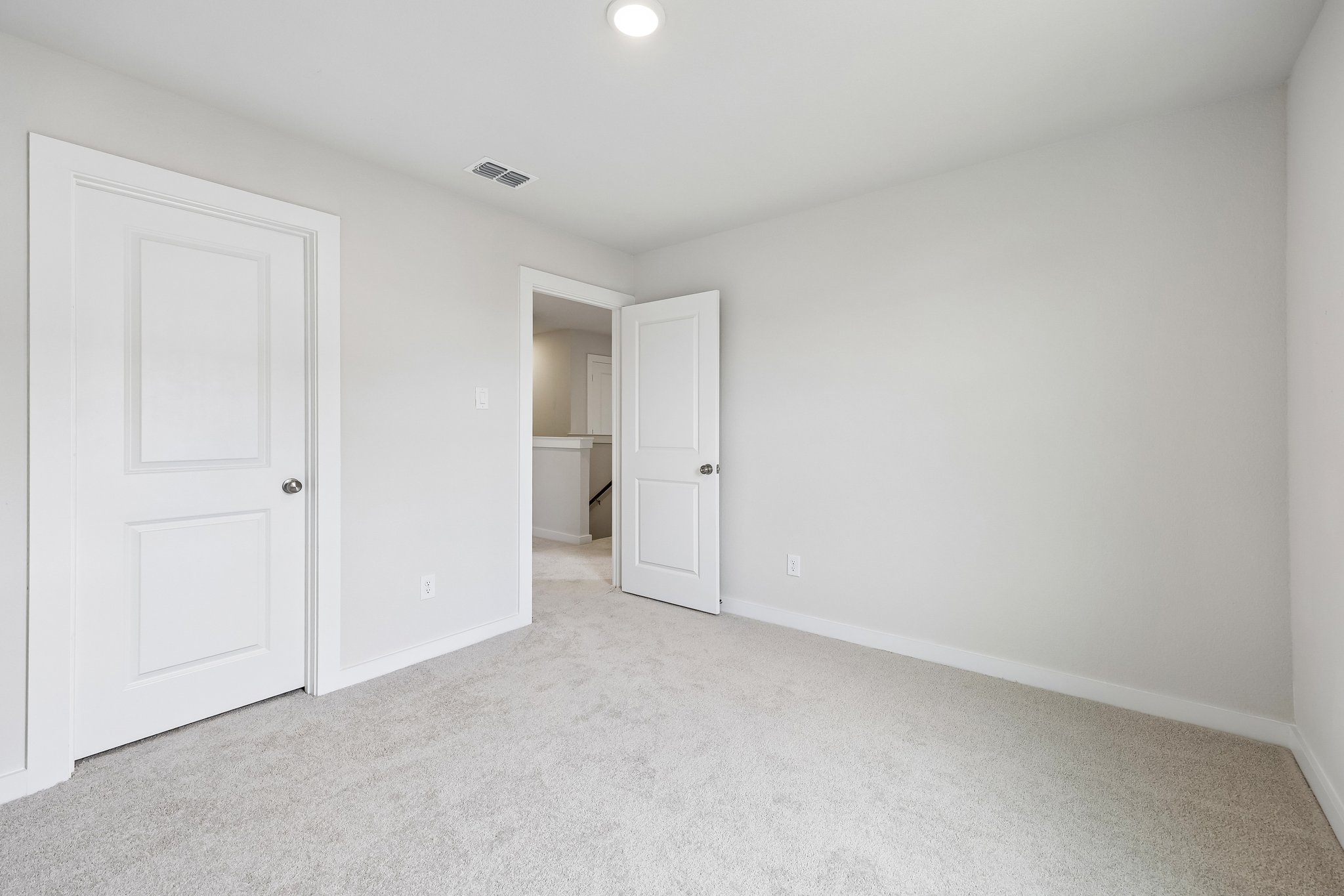 A room with white doors.