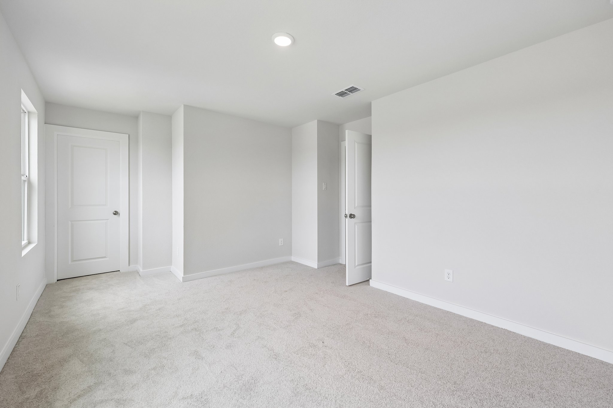 A room with white doors.