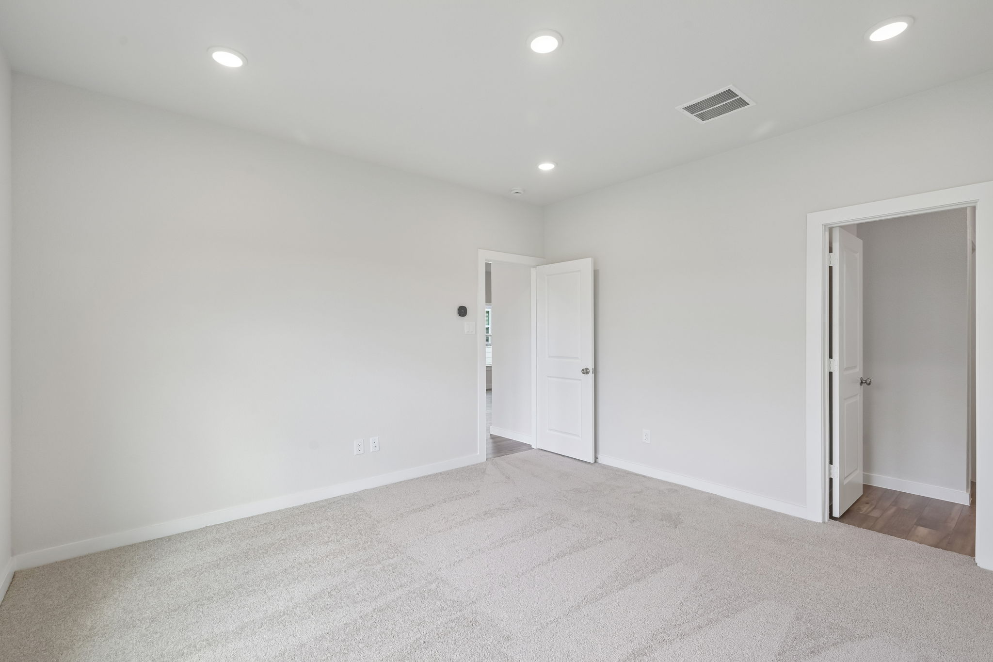 A room with white doors.