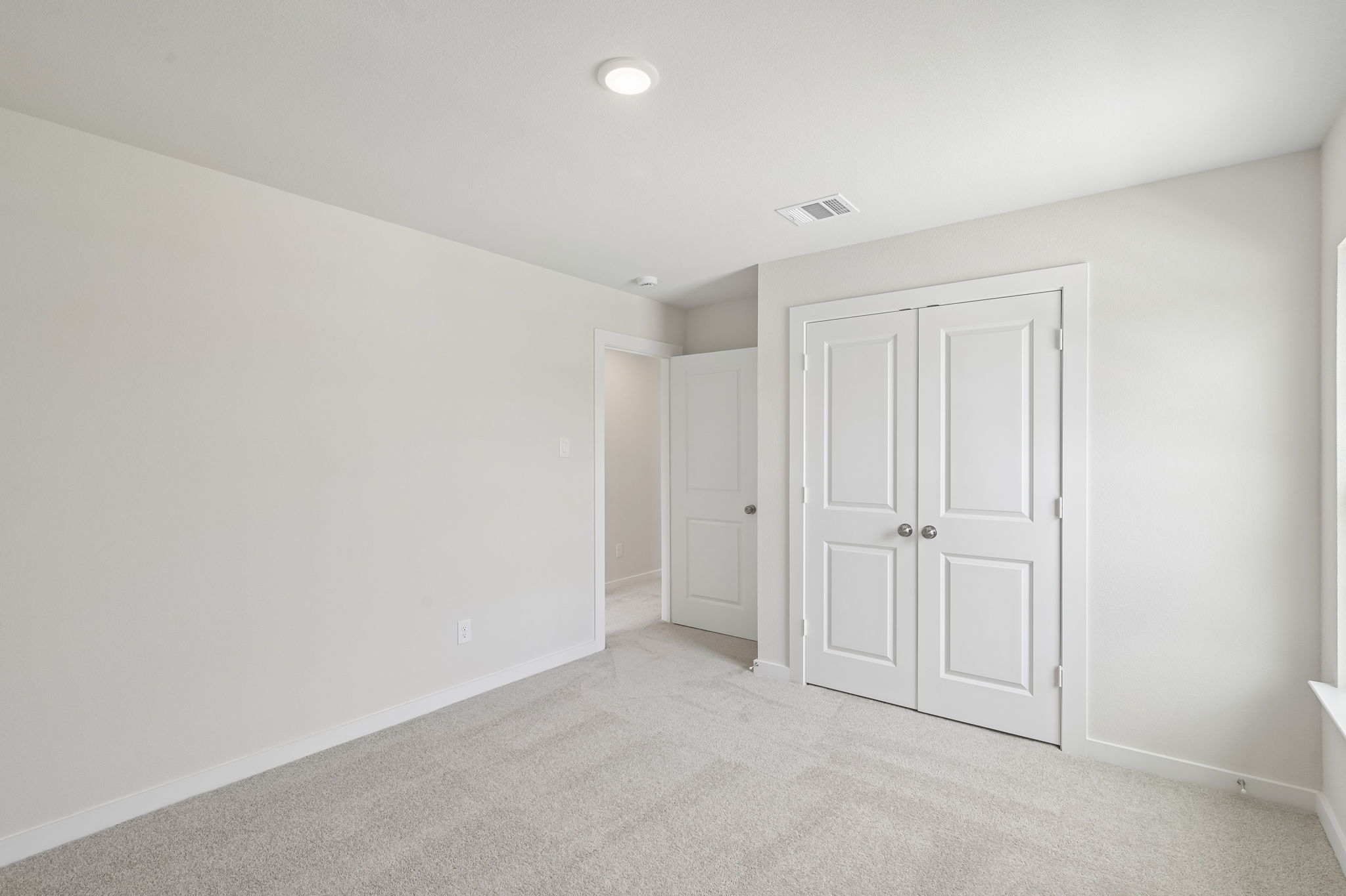 A room with white doors.