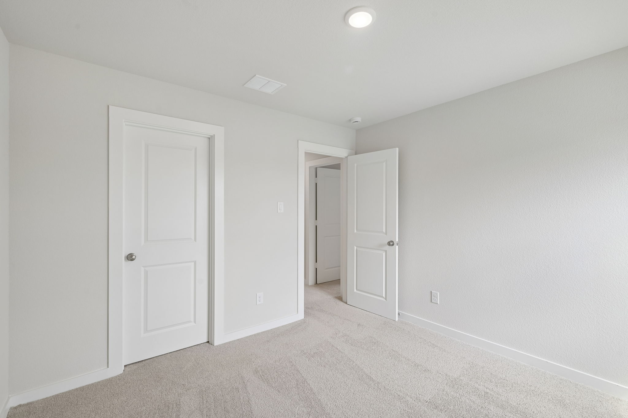 A room with white doors.